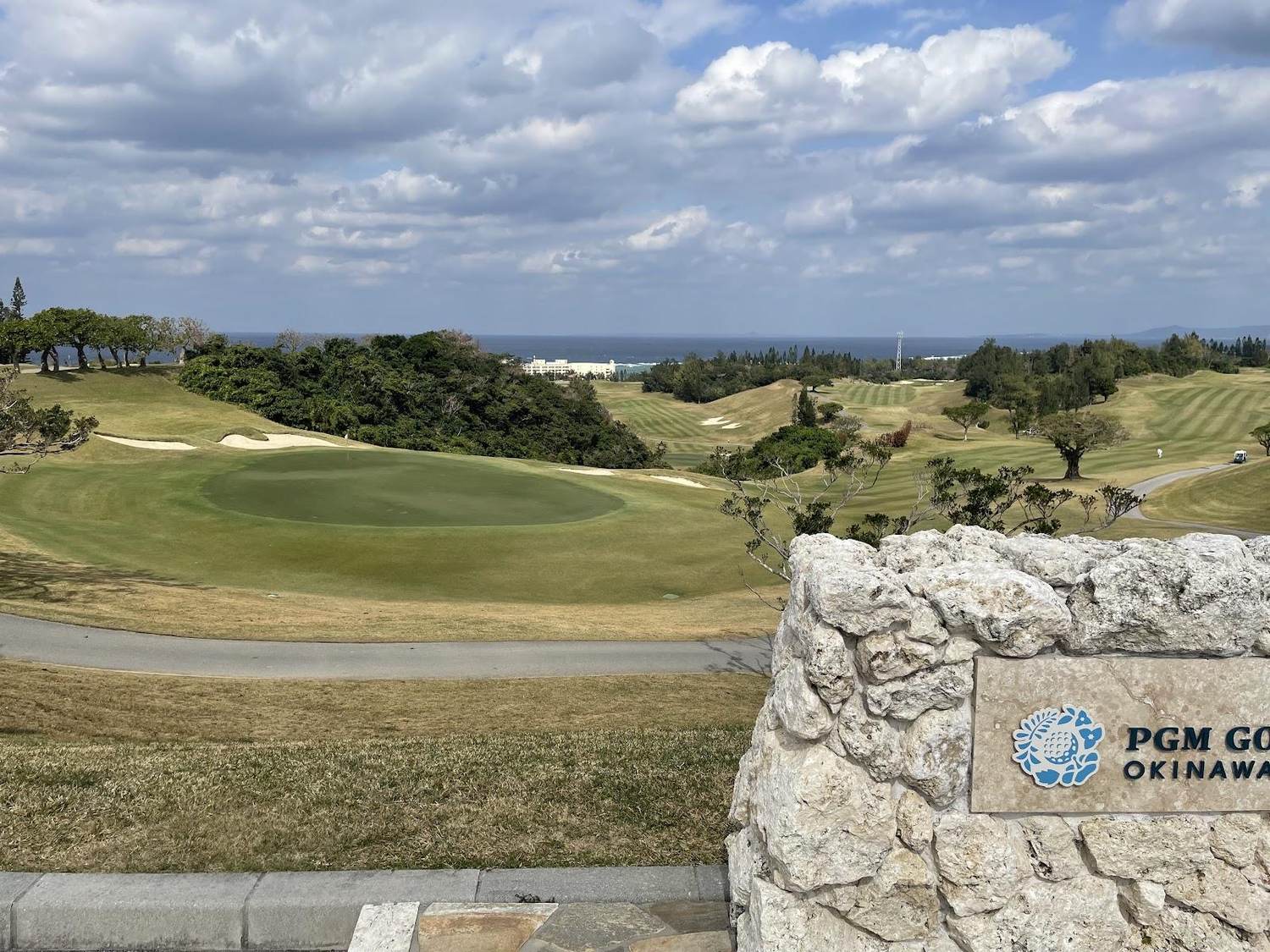 Golf course in Okinawa, Japan, fairway above the subtropical coastline of the East China Sea