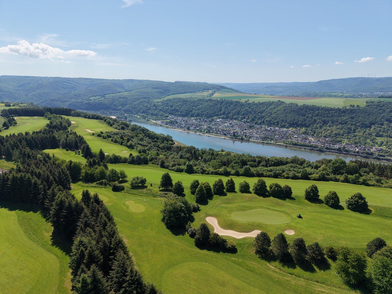 Fairways of Golfanlage Jakobsberg on its plateau between forest and vineyards above the Rhine gorge near Boppard, Germany