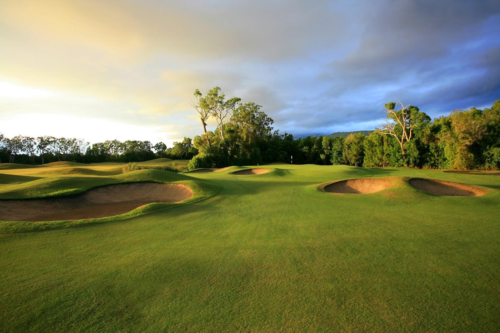 Palmer Sea Reef Golf Course, tropical fairway framed by palms and wetlands near Port Douglas, Queensland, Australia