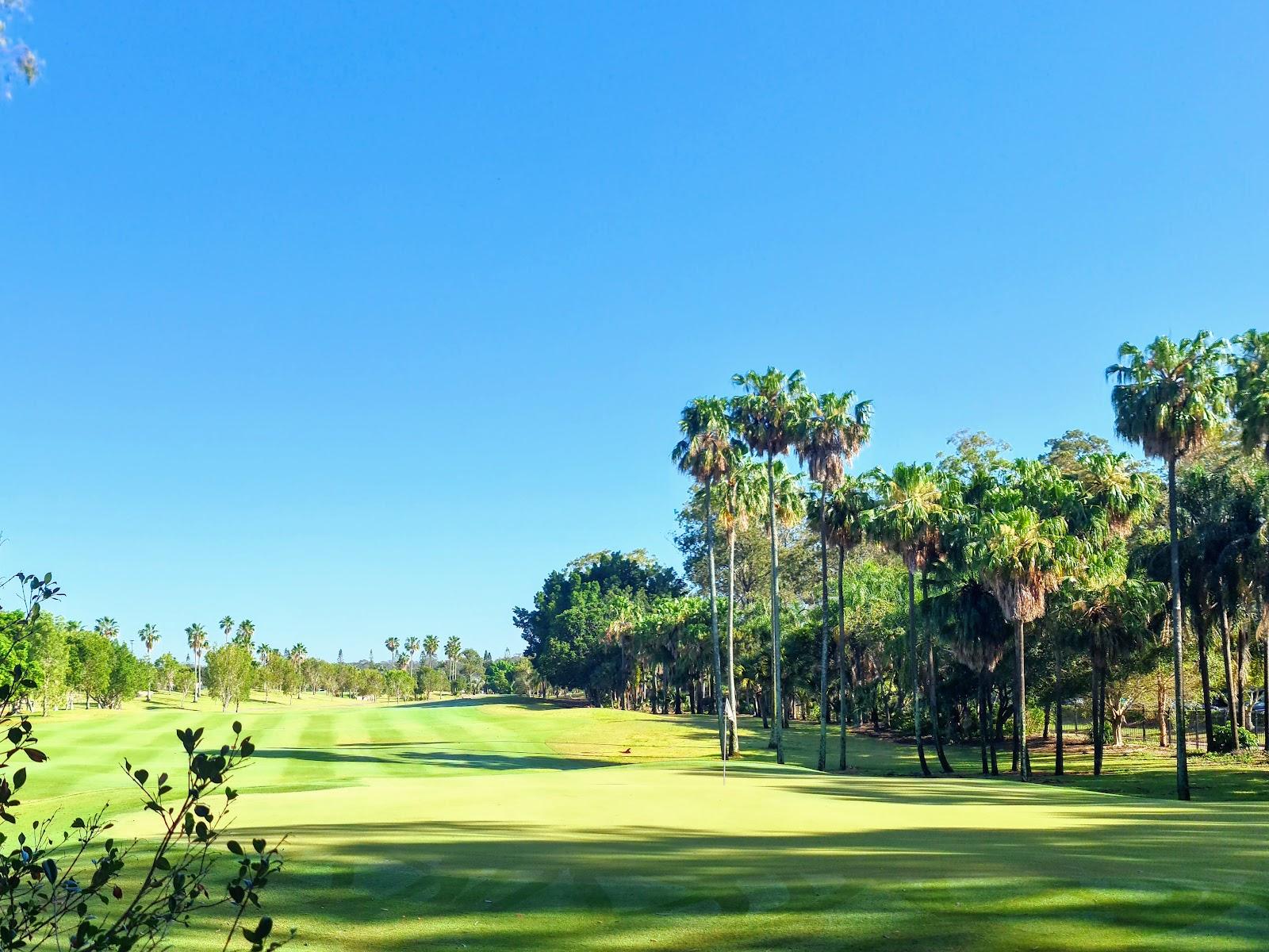 The Palms course at Sanctuary Cove on the Gold Coast, a well bunkered par 70 fairway among cabbage palms and water in Queensland