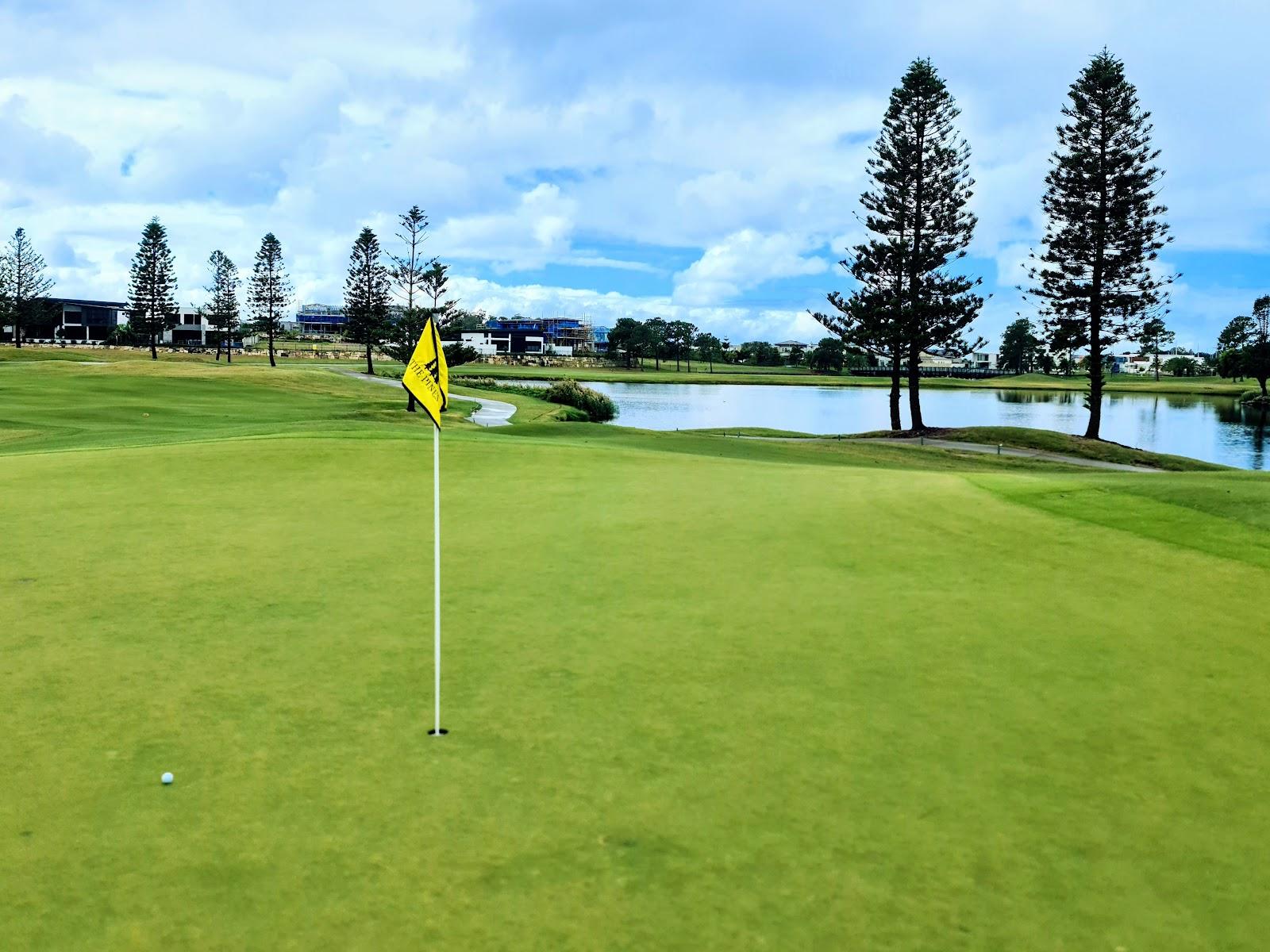 The Pines course at Sanctuary Cove on the Gold Coast, an Arnold Palmer fairway through pine forest with lakes in Queensland