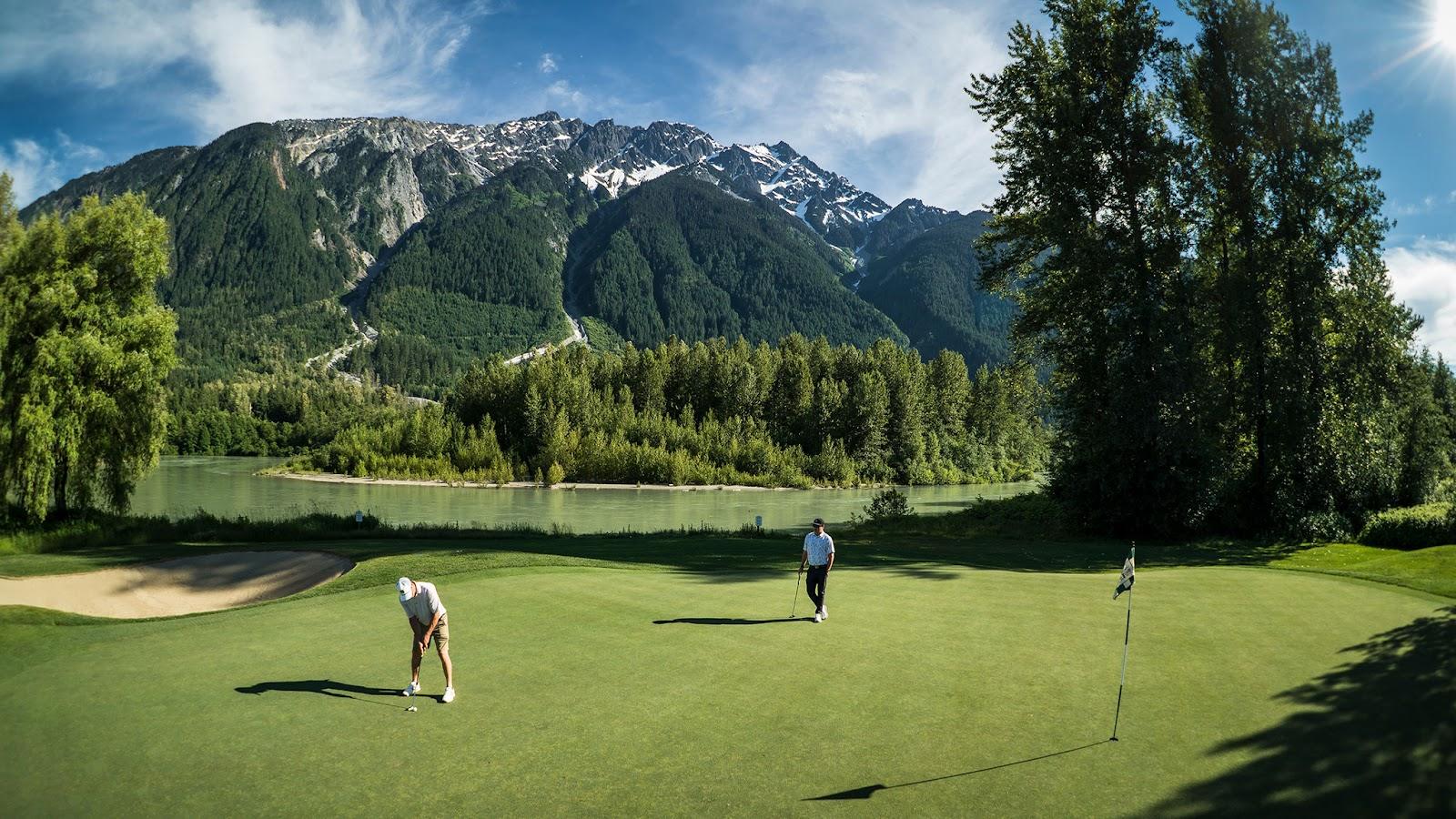 Big Sky Golf Club, valley fairway below snow capped Mount Currie near Whistler, British Columbia, Canada