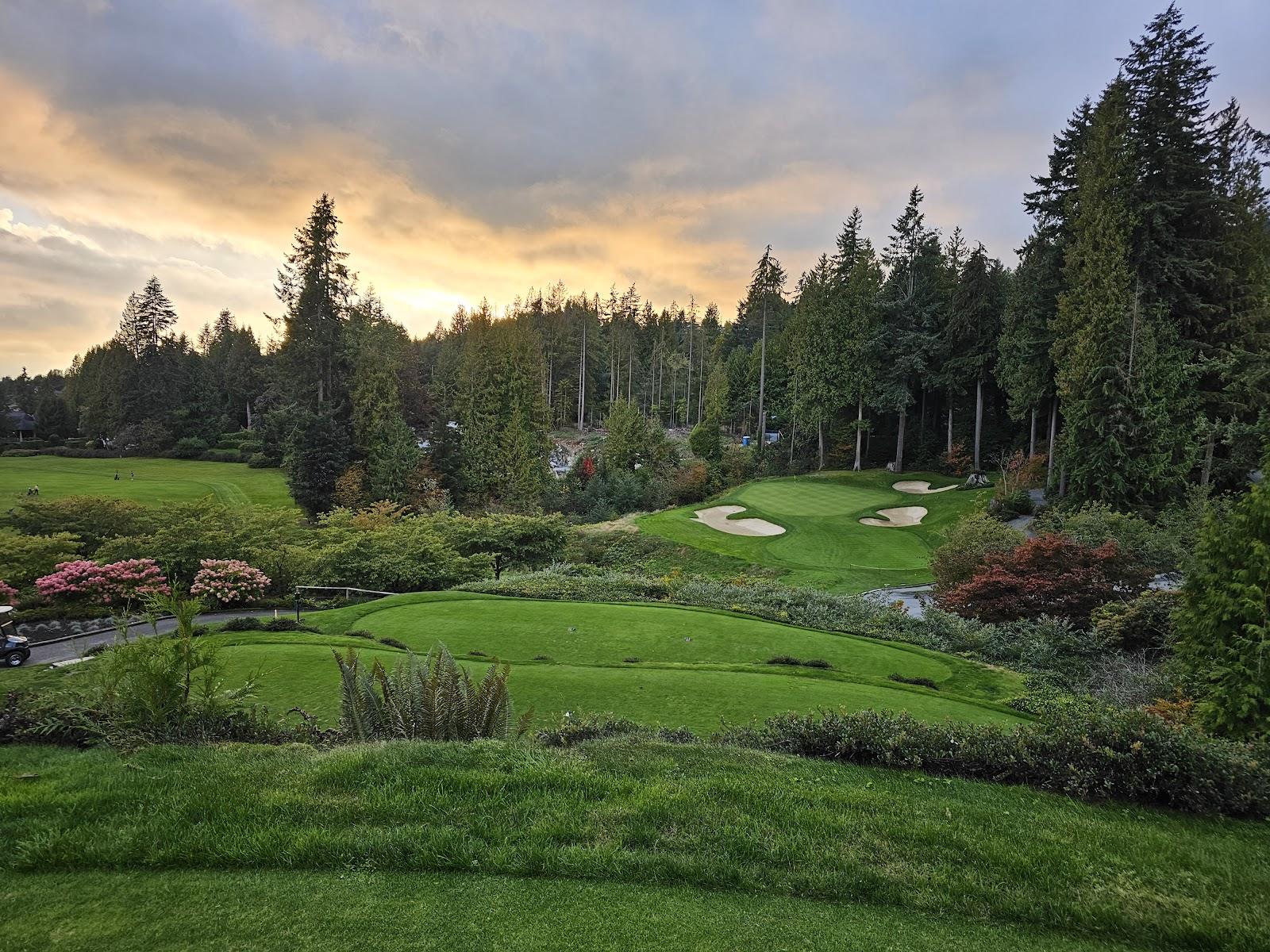 Capilano Golf and Country Club fairways descending the forested mountainside above West Vancouver, British Columbia, Canada