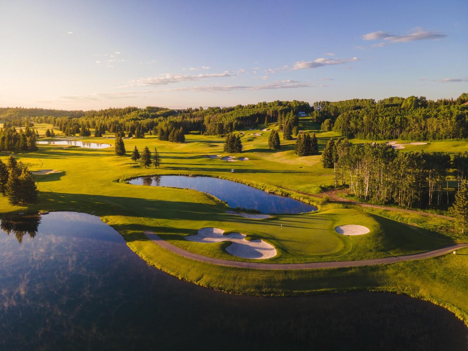The Glencoe Golf and Country Club near Calgary, a parkland fairway along the wooded banks of the Elbow River, Alberta, Canada