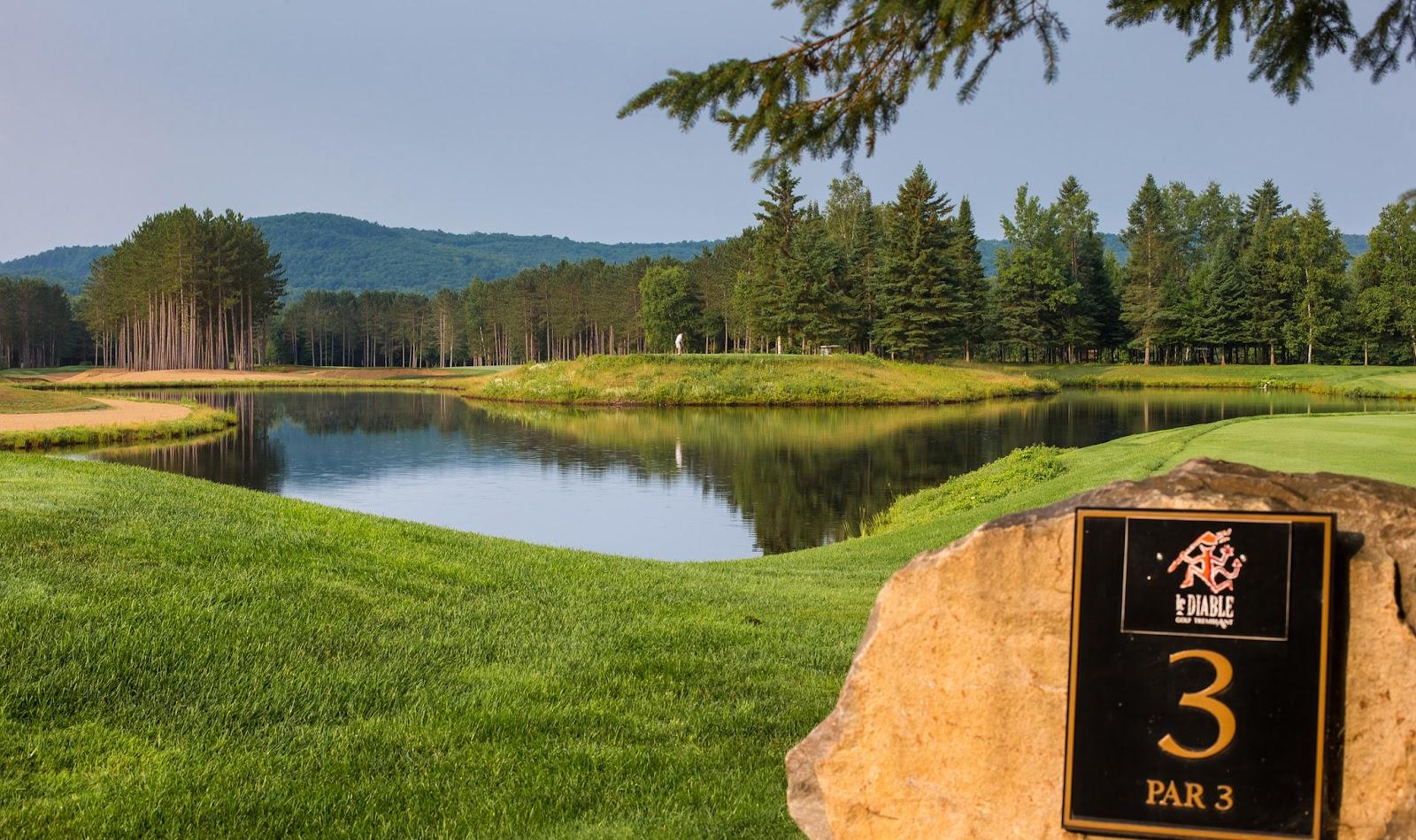 Le Diable golf course at Mont-Tremblant, fairway lined with red sand bunkers in the Laurentians, Quebec, Canada