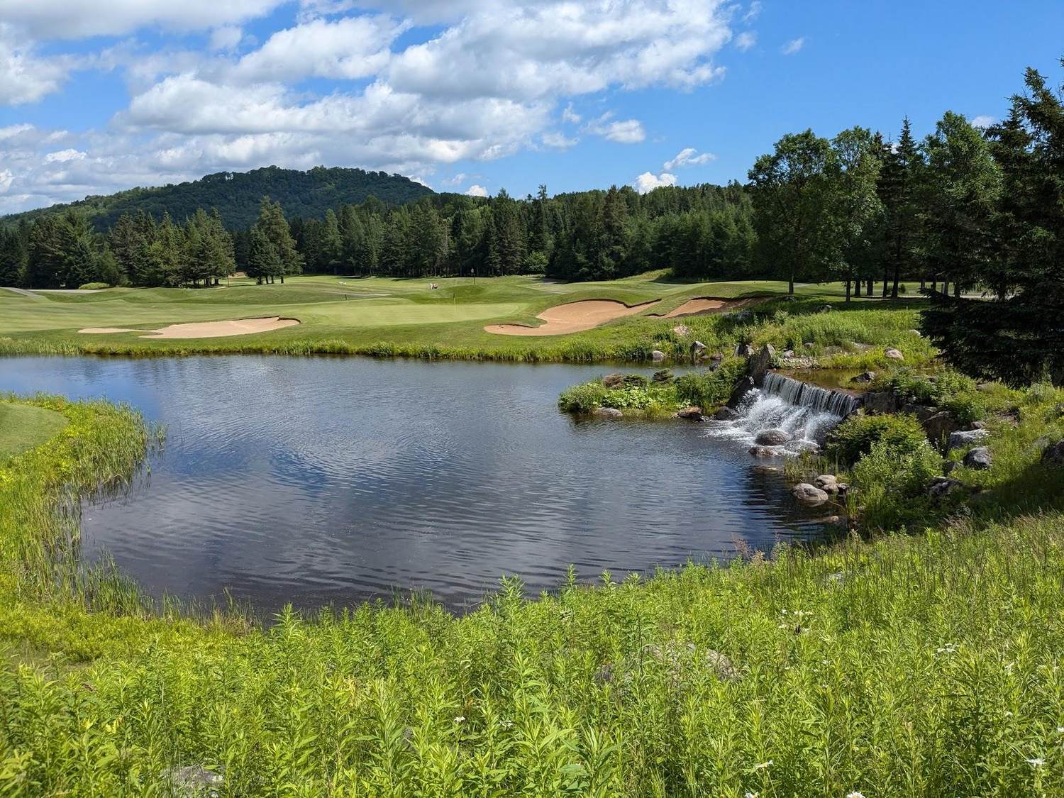 Mont-Tremblant Golf Club, the Le Maitre fairway along the Diable river in the Laurentians, Quebec, Canada