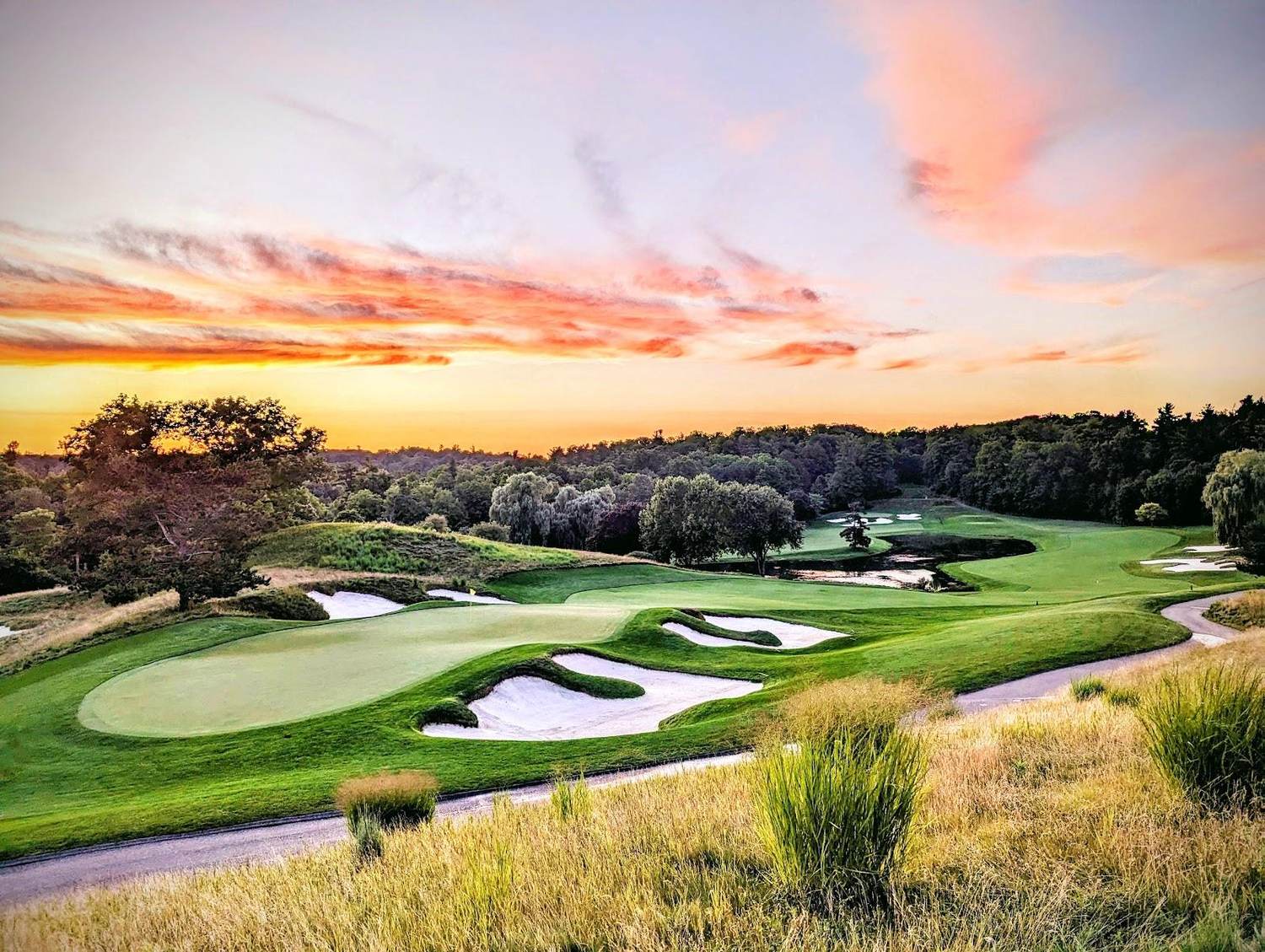 The National Golf Club of Canada, Woodbridge, tree lined fairway dropping through a wooded river valley