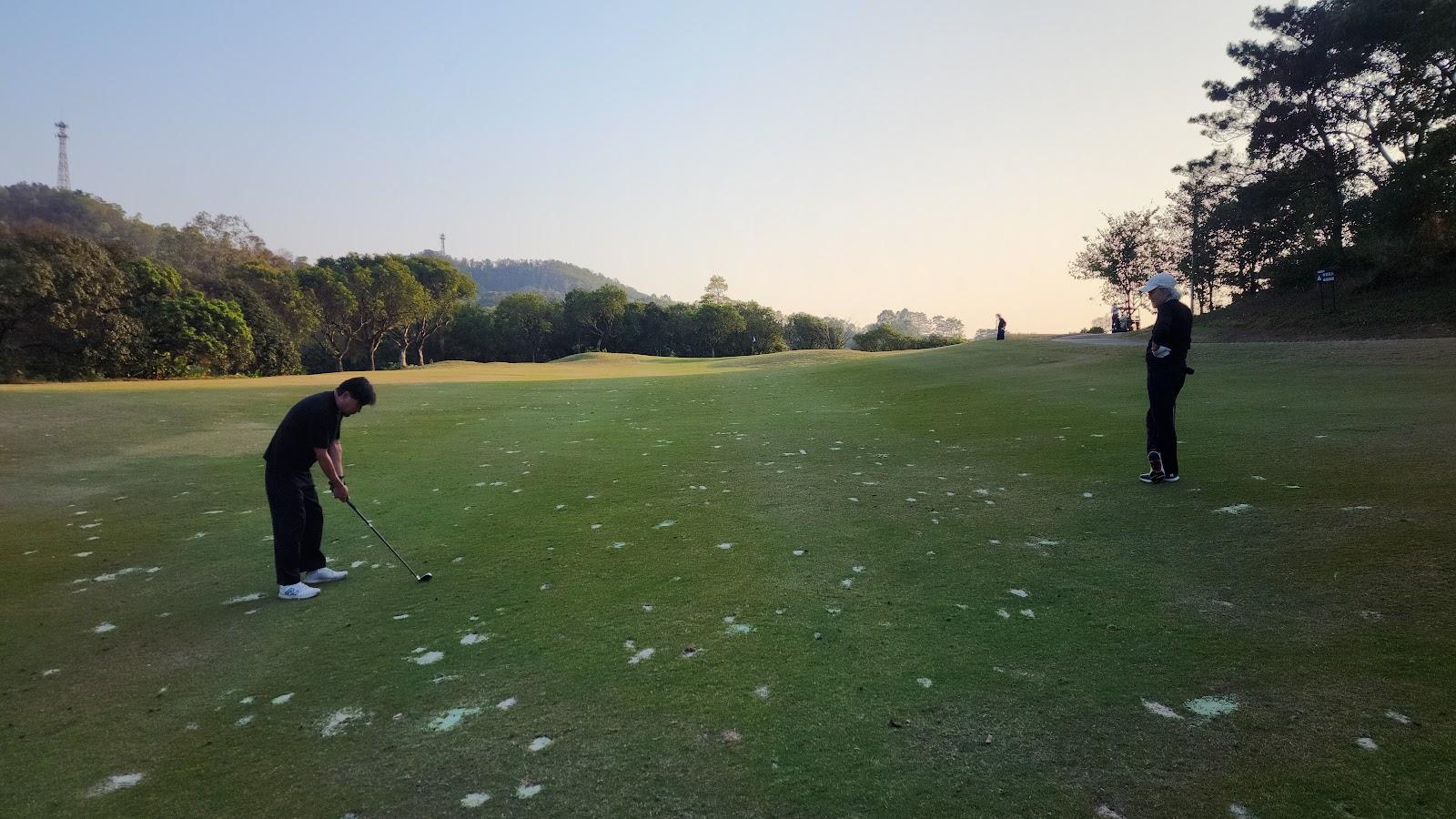 Dragon Lake Golf Club, parkland fairway and lake in the Huadu district north of Guangzhou, China