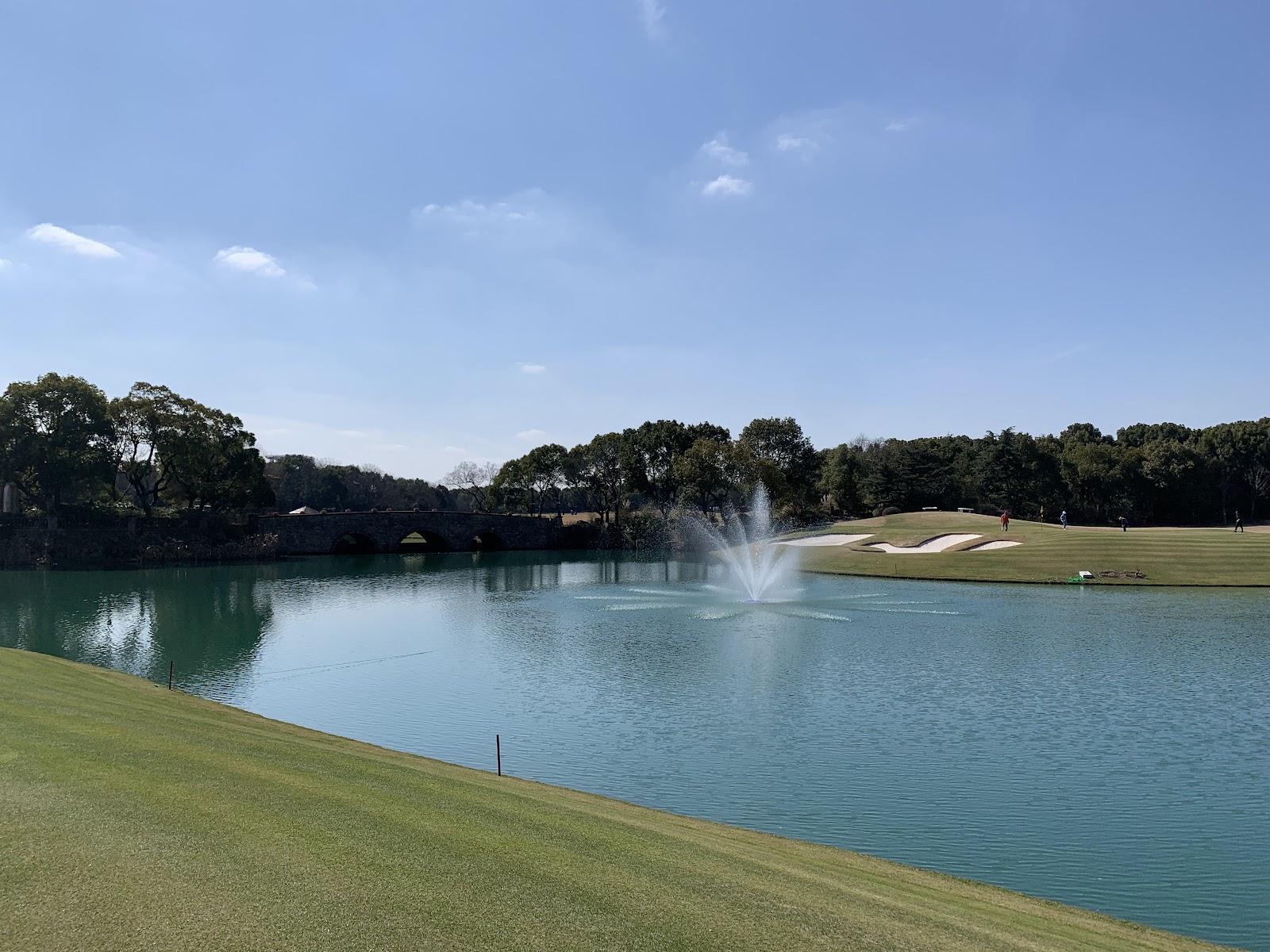 Sheshan International Golf Club, fairway and quarry lake on the wooded hills near Shanghai, China
