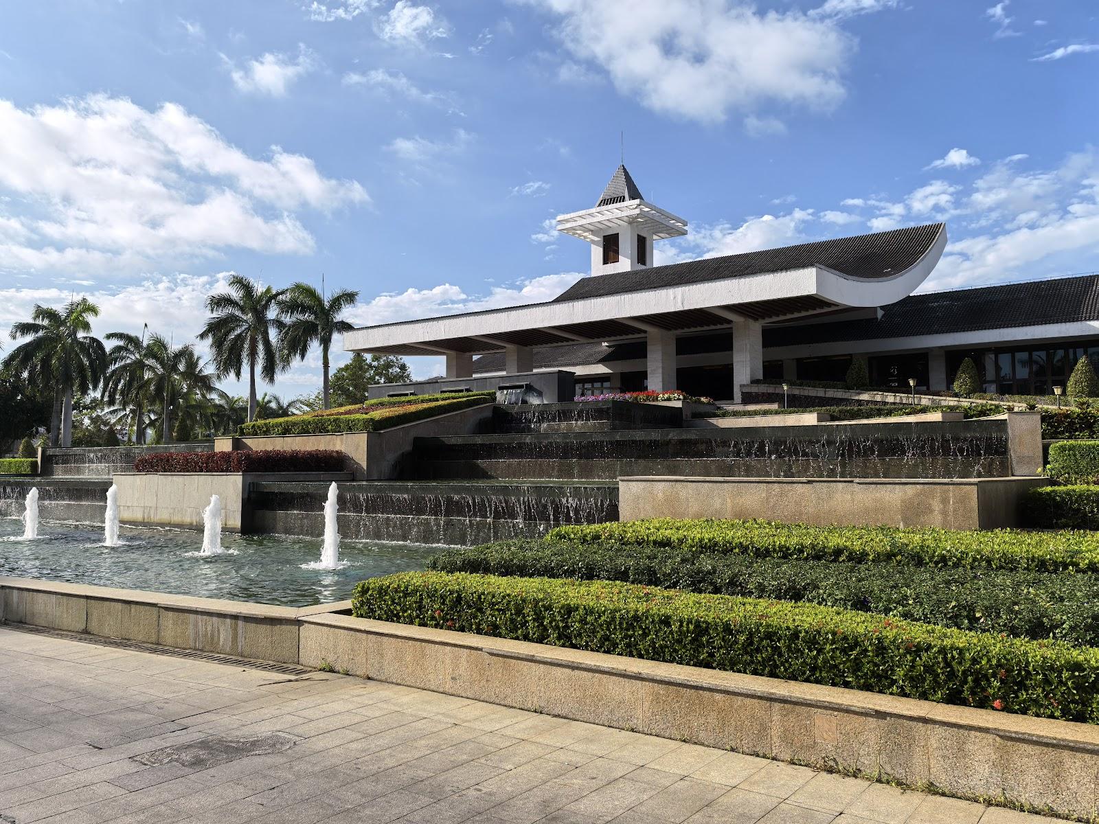 Yalong Bay Golf Club, tropical fairway framed by coconut palms near the South China Sea, Sanya, China