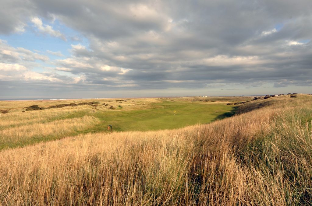 Goswick Links Golf Club, rolling links fairway and dunes on the Northumberland coast near Berwick-upon-Tweed, England