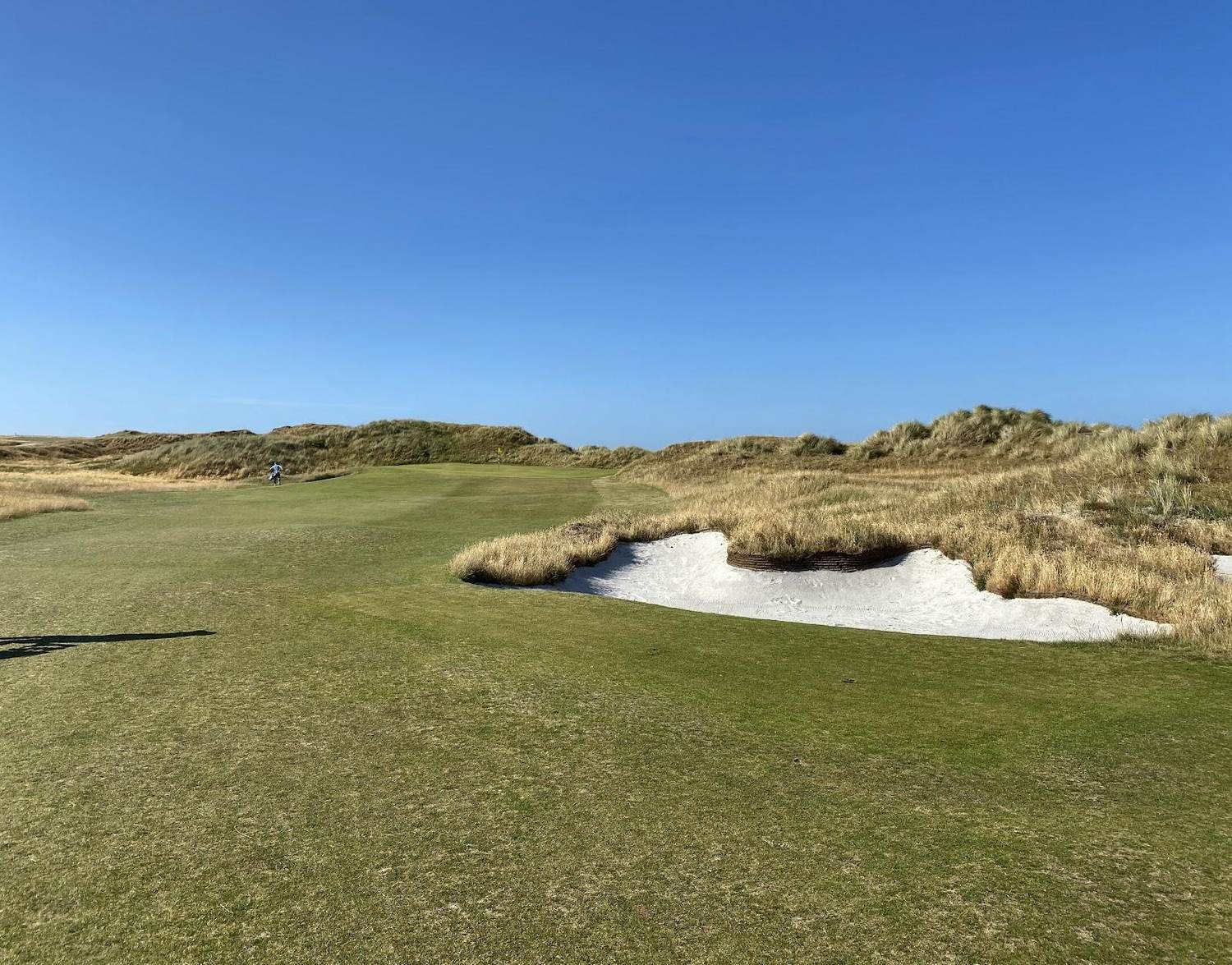 Hayling Golf Club, links fairway running through dunes toward the sea on Hayling Island, Hampshire, England