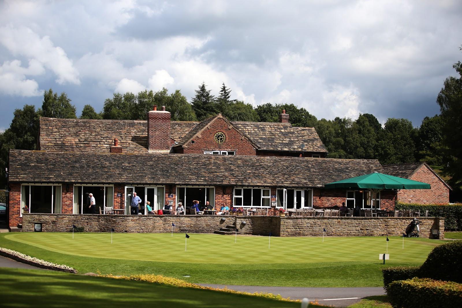 Prestbury Golf Club, rolling parkland fairway and tree framed green near Macclesfield in Cheshire, England