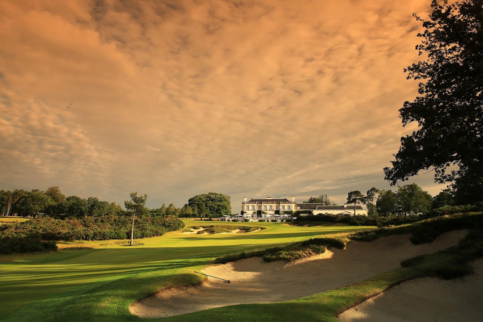 Queenwood Golf Club, heathland fairway framed by heather and pine in Surrey, England