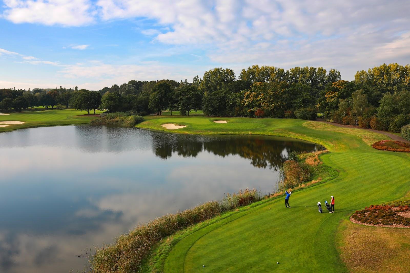 The Wisley Golf Club, parkland fairway and water near Woking in Surrey, England