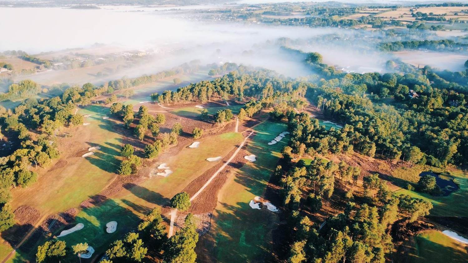 West Sussex Golf Club at Pulborough, heathland fairway framed by heather, pine and silver birch in the South Downs, England