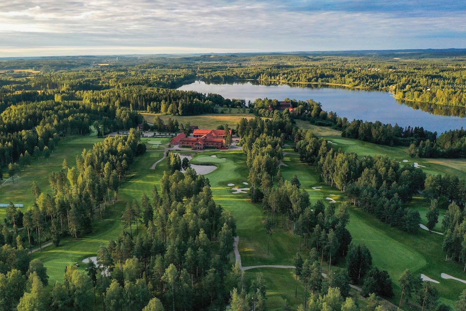Linna Golf, parkland fairway framed by Finnish pine forest near Hameenlinna, Finland