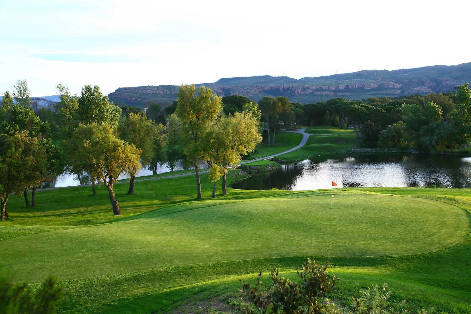 Golf de Saint-Endreol, wooded fairway and lake through the Var hills at La Motte, France