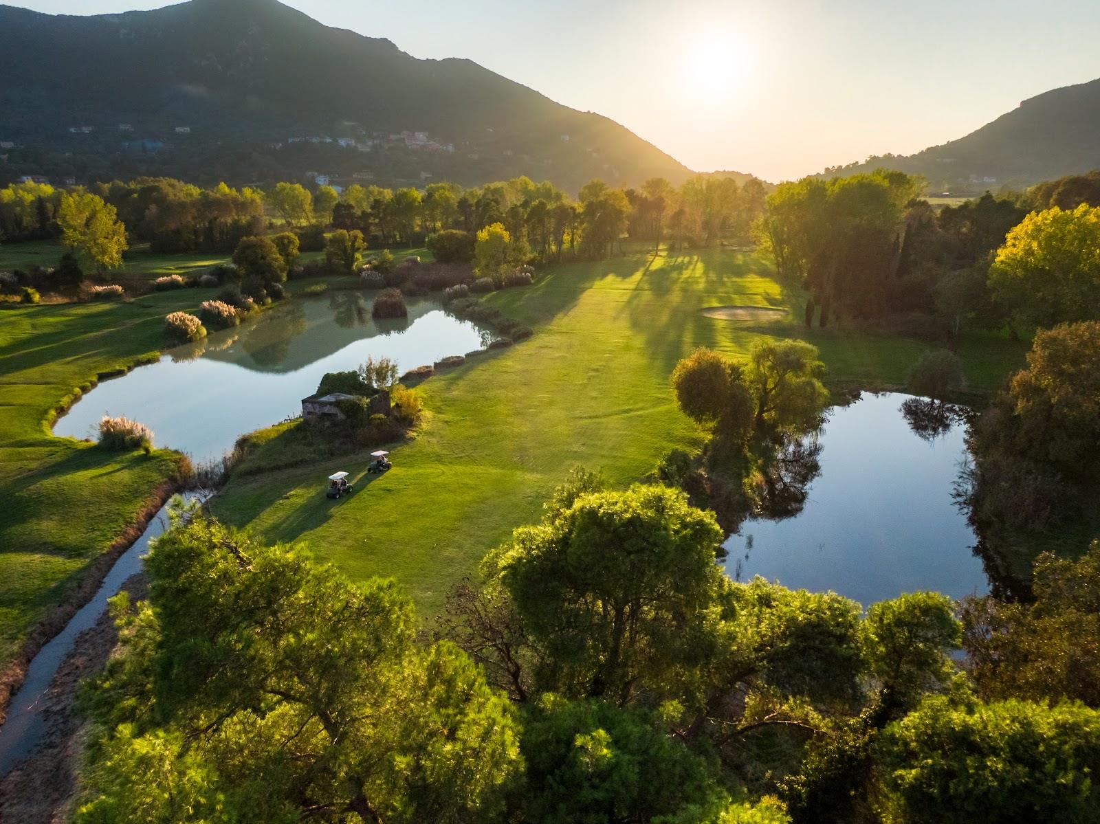 Corfu Golf Club, green and water hazard in the Ropa Valley near Ermones on the island of Corfu, Greece