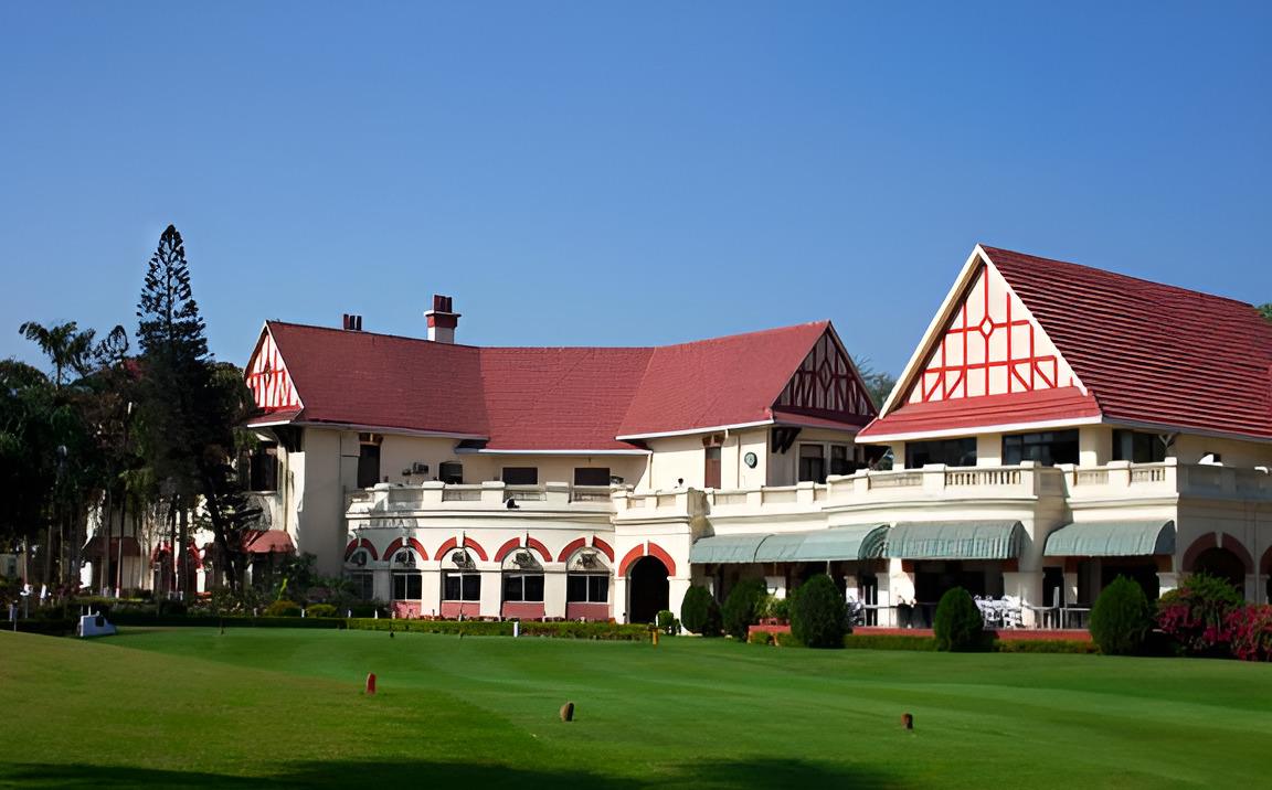 Royal Calcutta Golf Club, flat championship fairway and water hazard in Kolkata, India