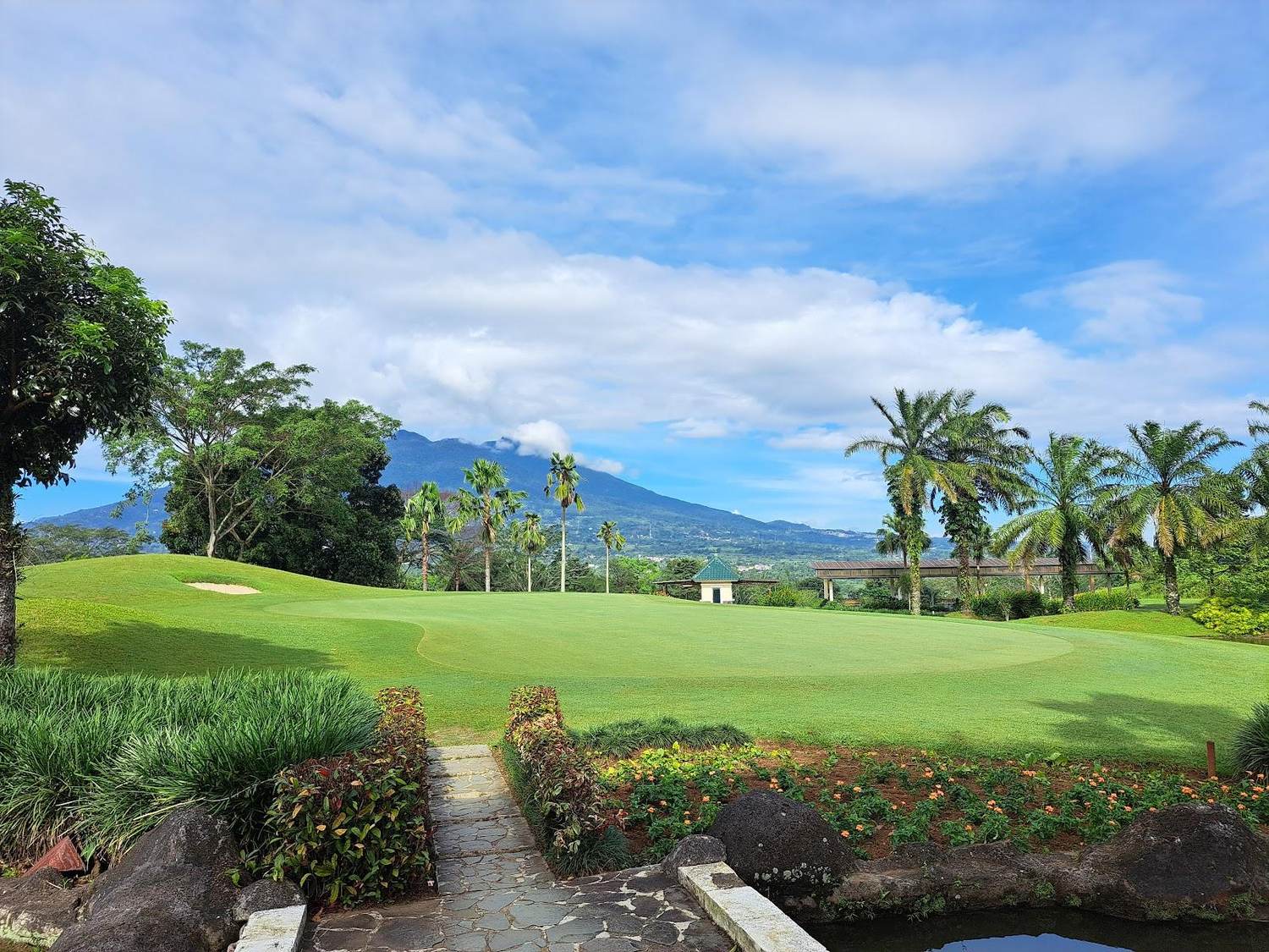 Rancamaya Golf and Country Club, parkland fairway below Mount Salak near Bogor, West Java, Indonesia