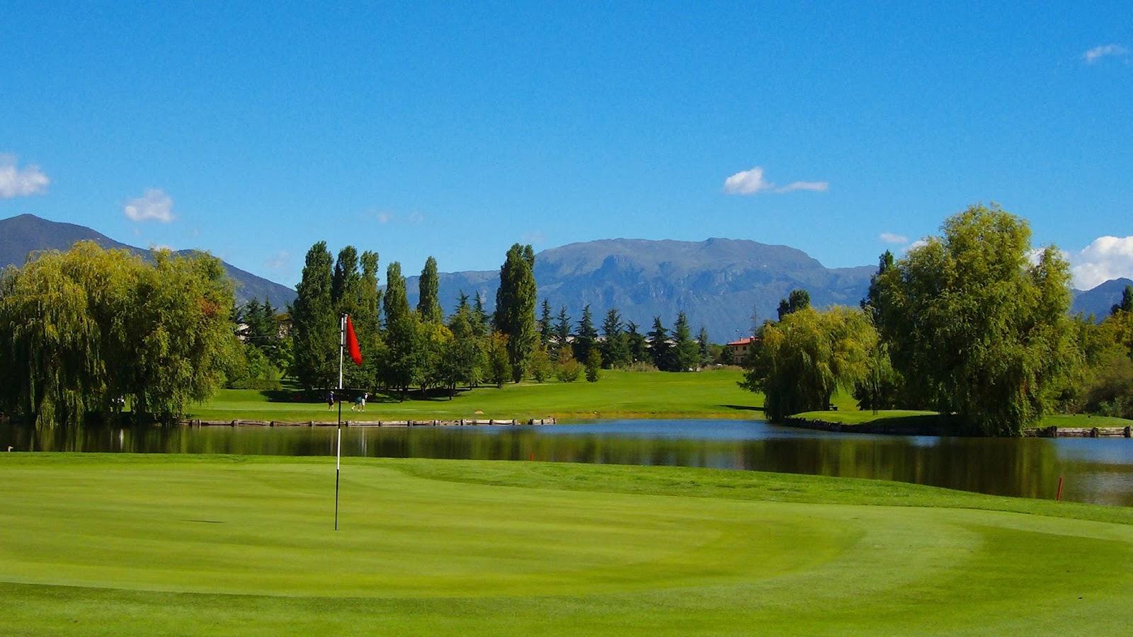 Franciacorta Golf Club, fairway running past vineyards and water in Lombardy, Italy