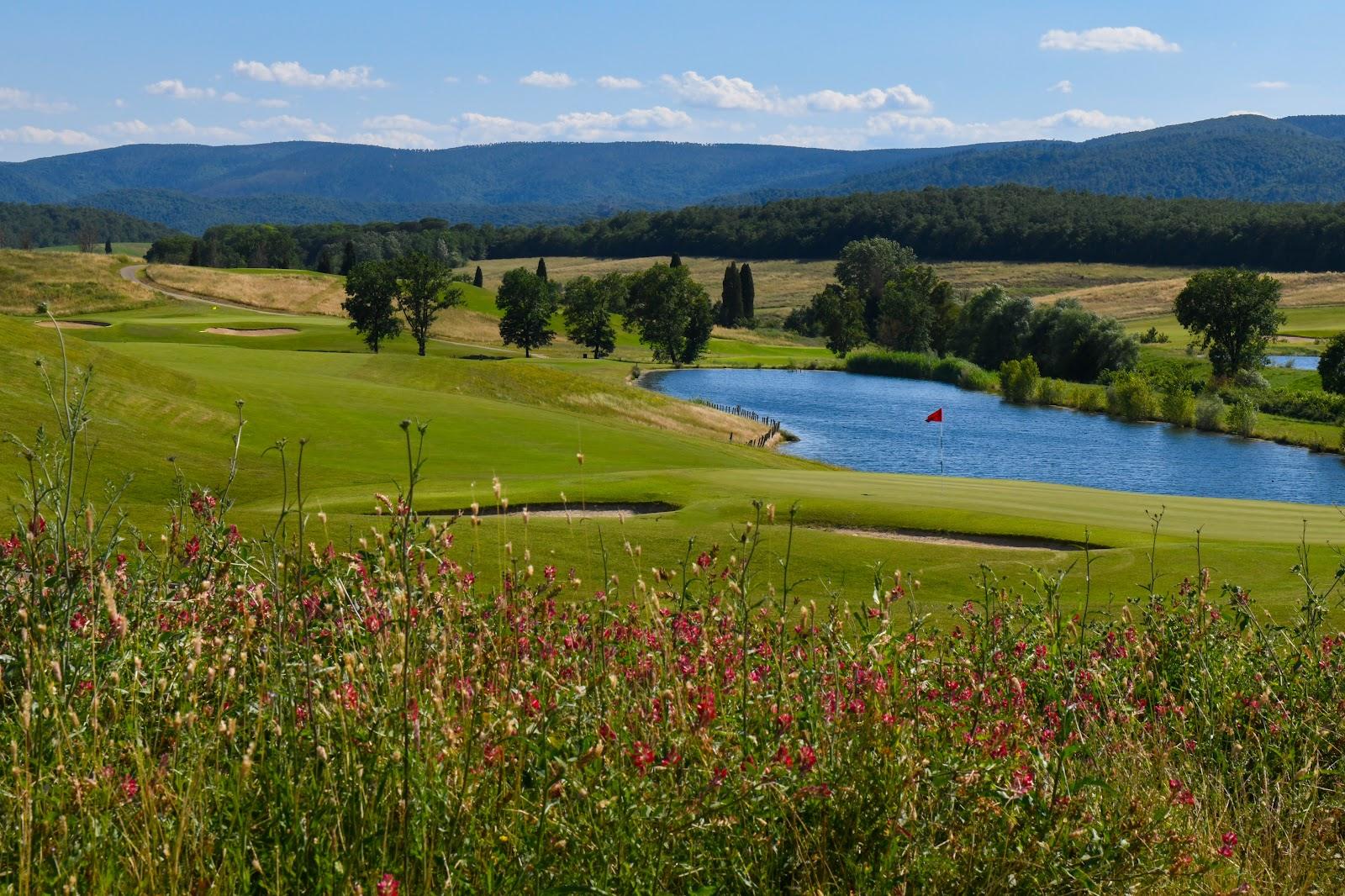 Royal Golf La Bagnaia, fairway rolling through the Tuscan hills with Siena in the distance, Italy