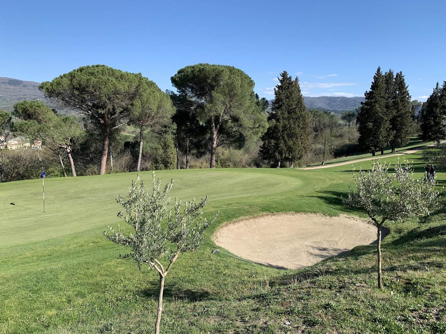 Ugolino Golf Club, fairway rolling through Chianti vines and olive groves south of Florence, Italy