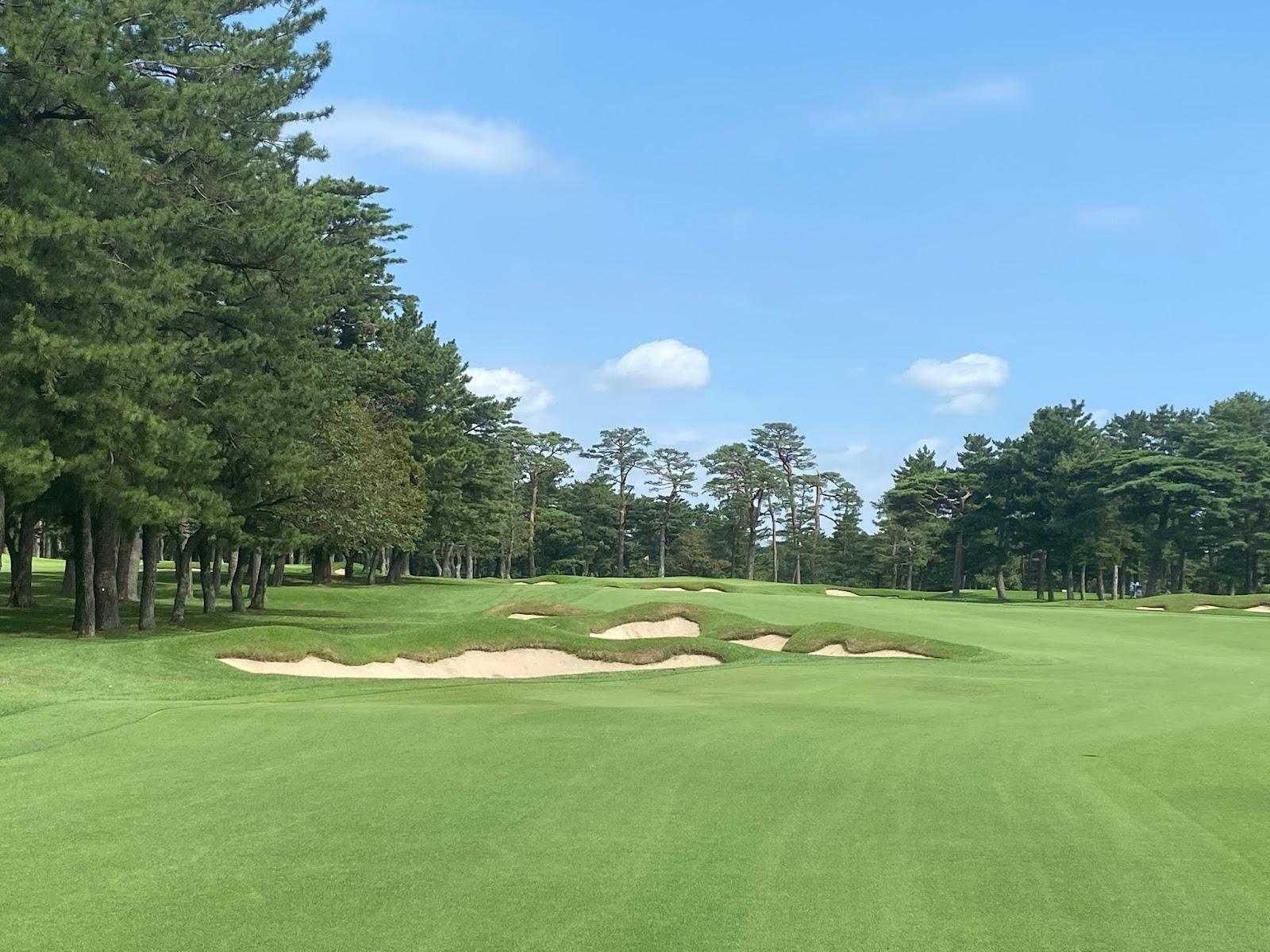 Abiko Golf Club, tree lined fairway and green near Lake Teganuma in Chiba, Japan
