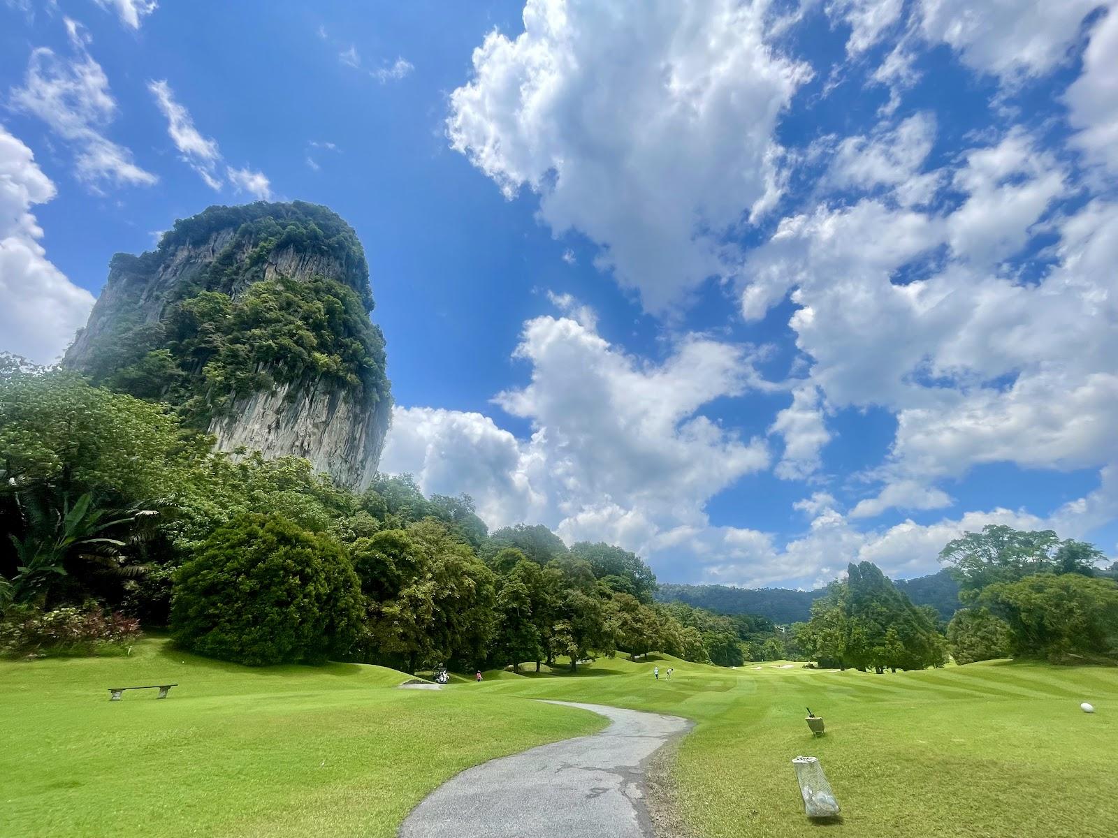 Templer Park Country Club at Rawang, fairway set beneath jungle clad limestone hills near Kuala Lumpur, Malaysia