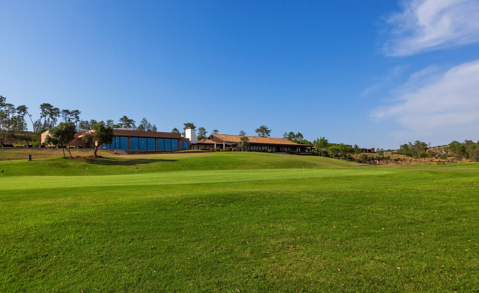 Morgado Golf Course near Portimao, a long Algarve fairway through a wide valley with the Monchique hills beyond