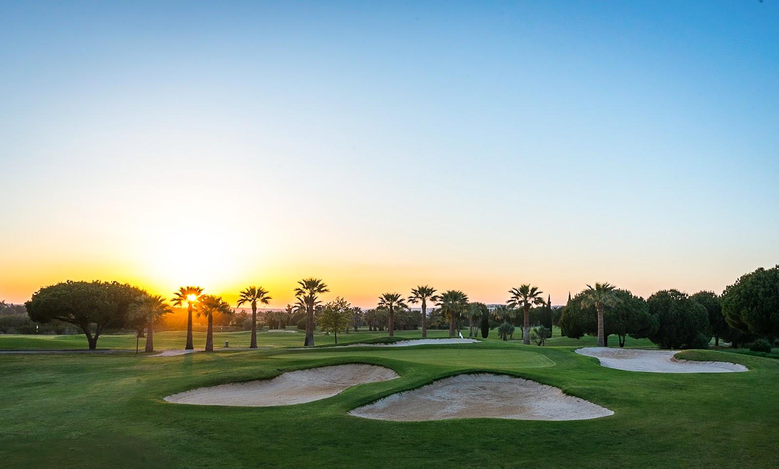 Vilamoura Laguna Golf, an open fairway running past a lake in the Vilamoura resort, Algarve