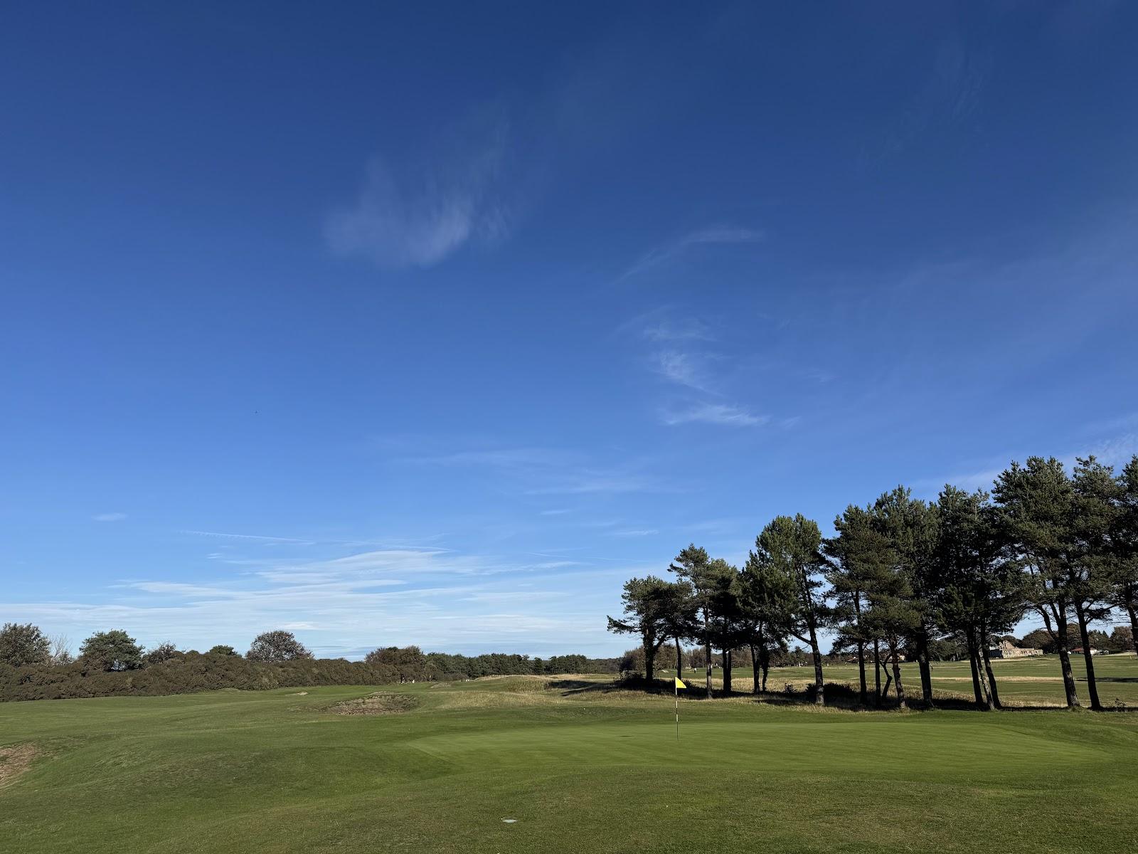 Longniddry Golf Club, fairway running between gorse and pines toward the Firth of Forth in East Lothian
