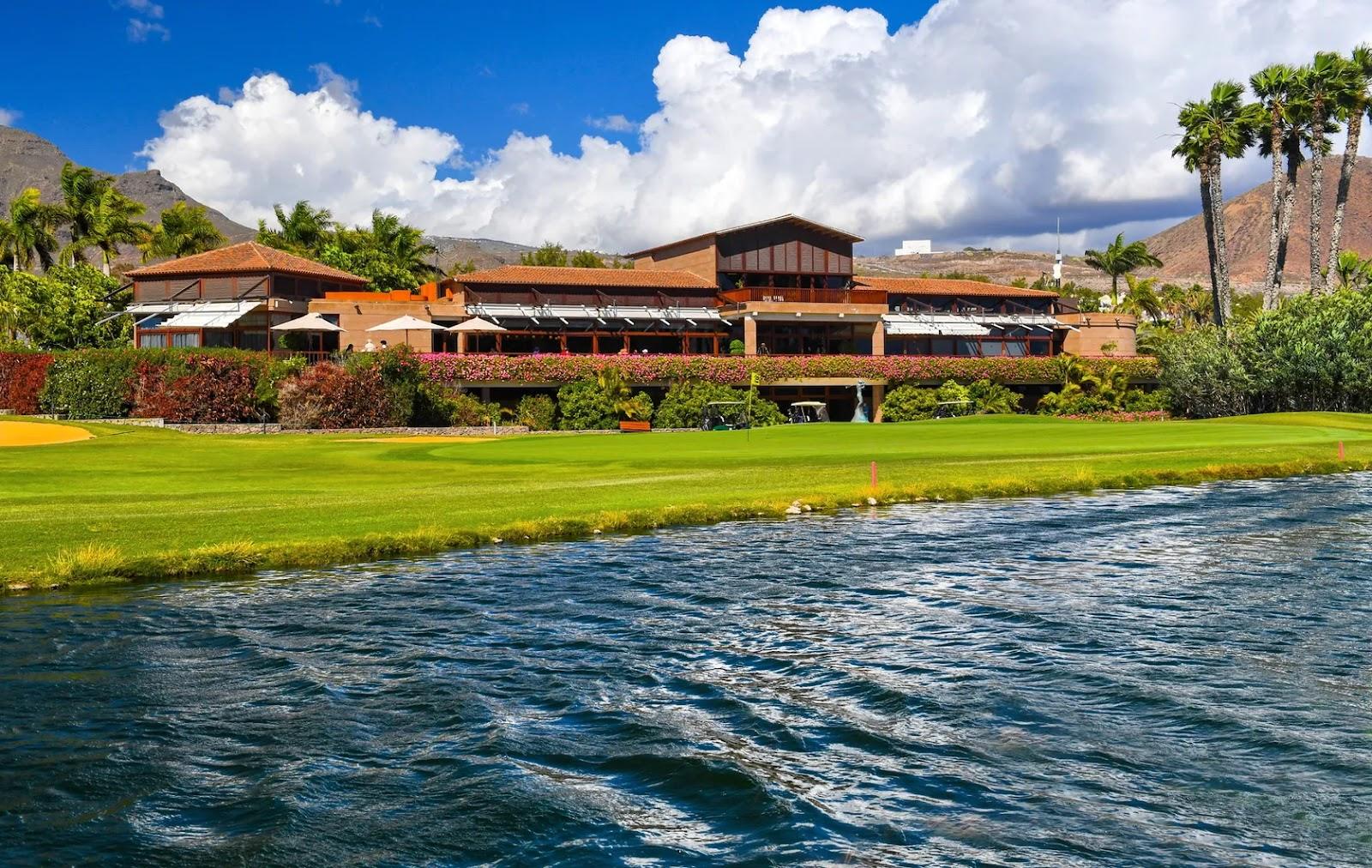 Golf Las Americas, palm lined fairways and lakes in a valley near Playa de las Americas, southern Tenerife