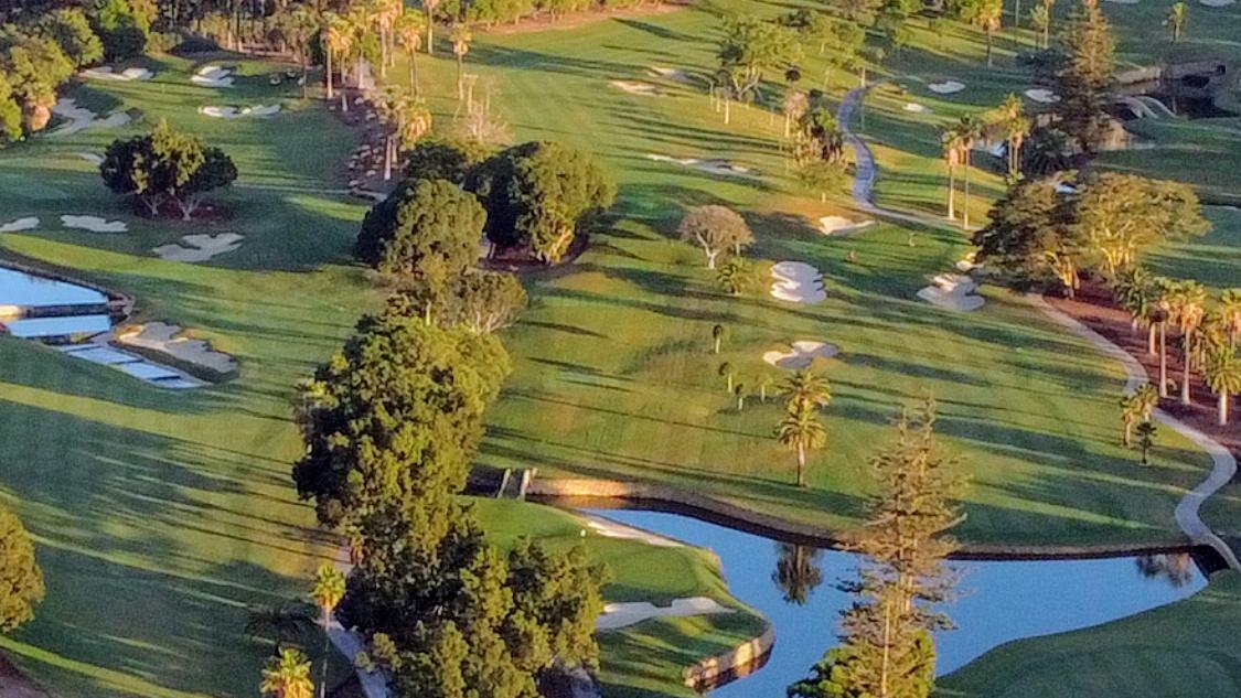 Real Club de Golf Las Brisas, parkland fairway with water and bold bunkering in Marbella's golf valley