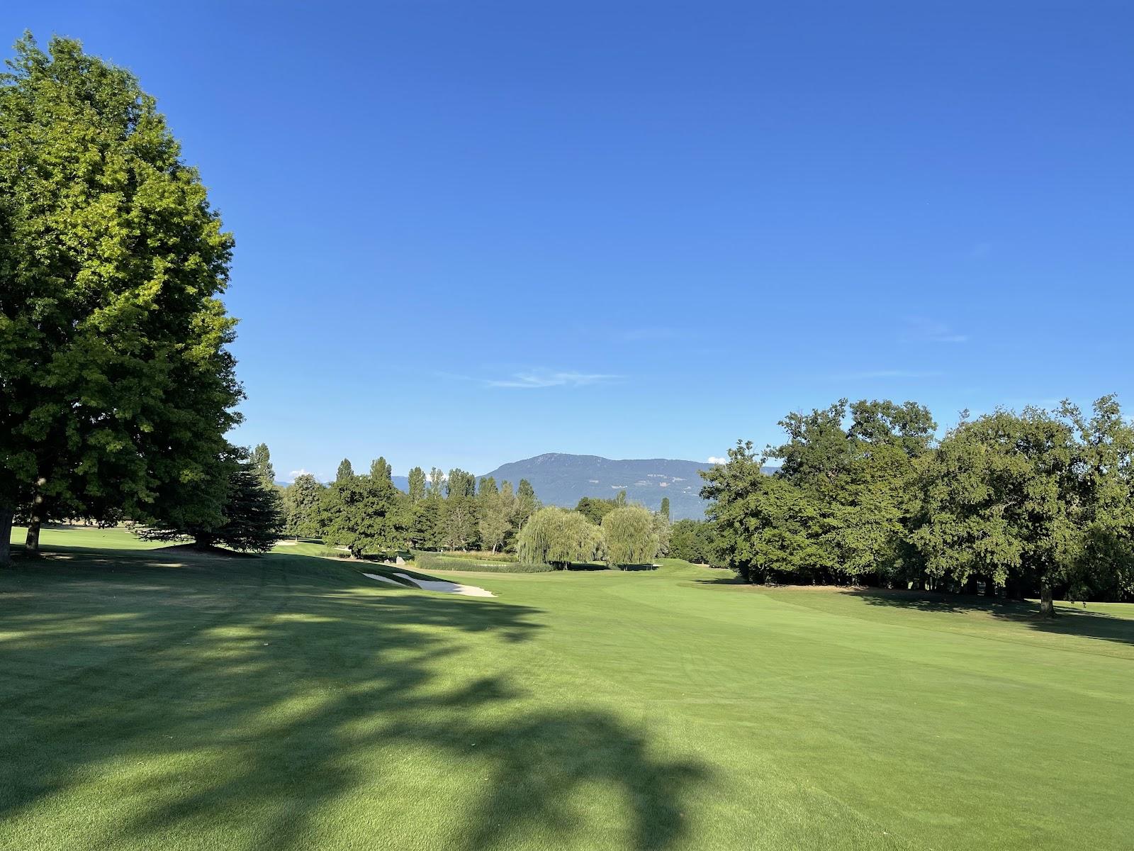 Golf Club de Geneve, parkland fairway framed by mature trees on the Cologny hillside above Geneva