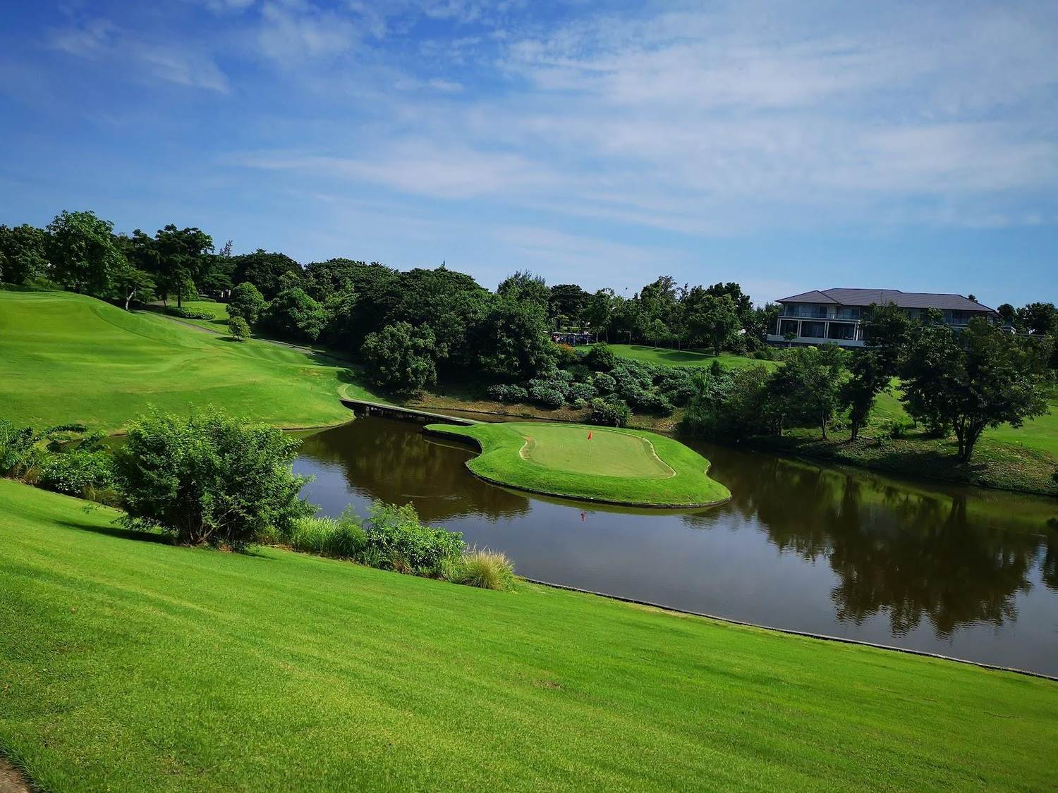 Riverdale Golf Club, rolling fairway and water hazard north of Bangkok in Pathum Thani, Thailand