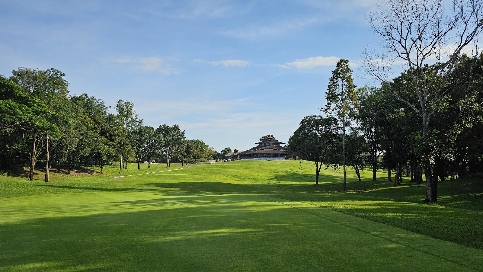 Santiburi Chiang Rai Country Club, fairways and lakes below the wooded hills of Wiang Chai, northern Thailand