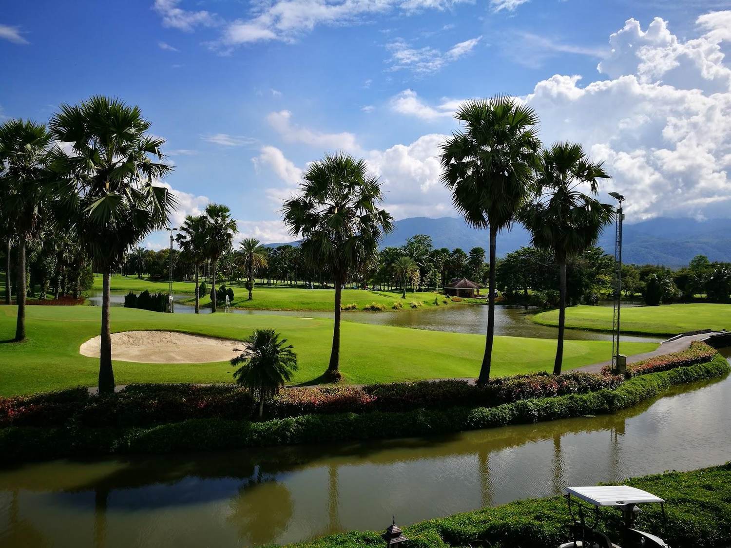 Summit Green Valley Chiangmai Country Club, palm lined fairways and lakes in the Mae Sa valley near Chiang Mai, Thailand