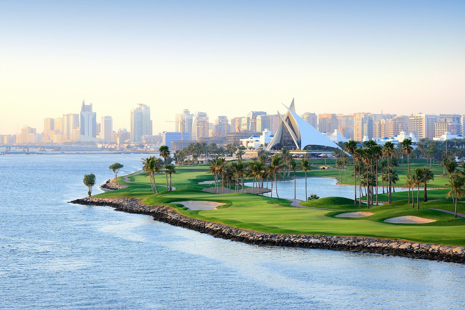 Dubai Creek Golf and Yacht Club fairways beside the marina and the sail shaped clubhouse in Deira, Dubai