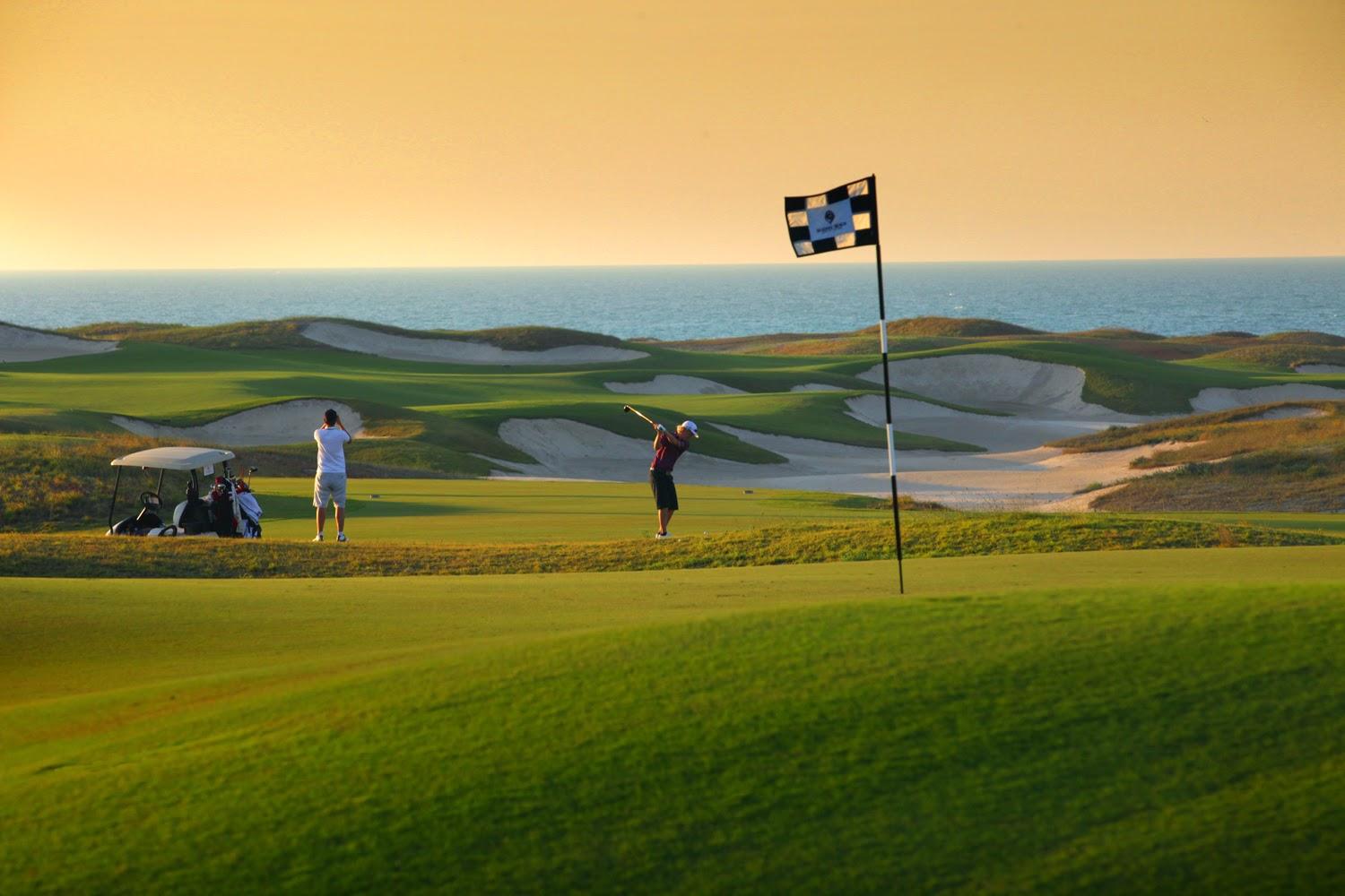 Saadiyat Beach Golf Club, a Gary Player fairway running toward the Arabian Gulf in Abu Dhabi