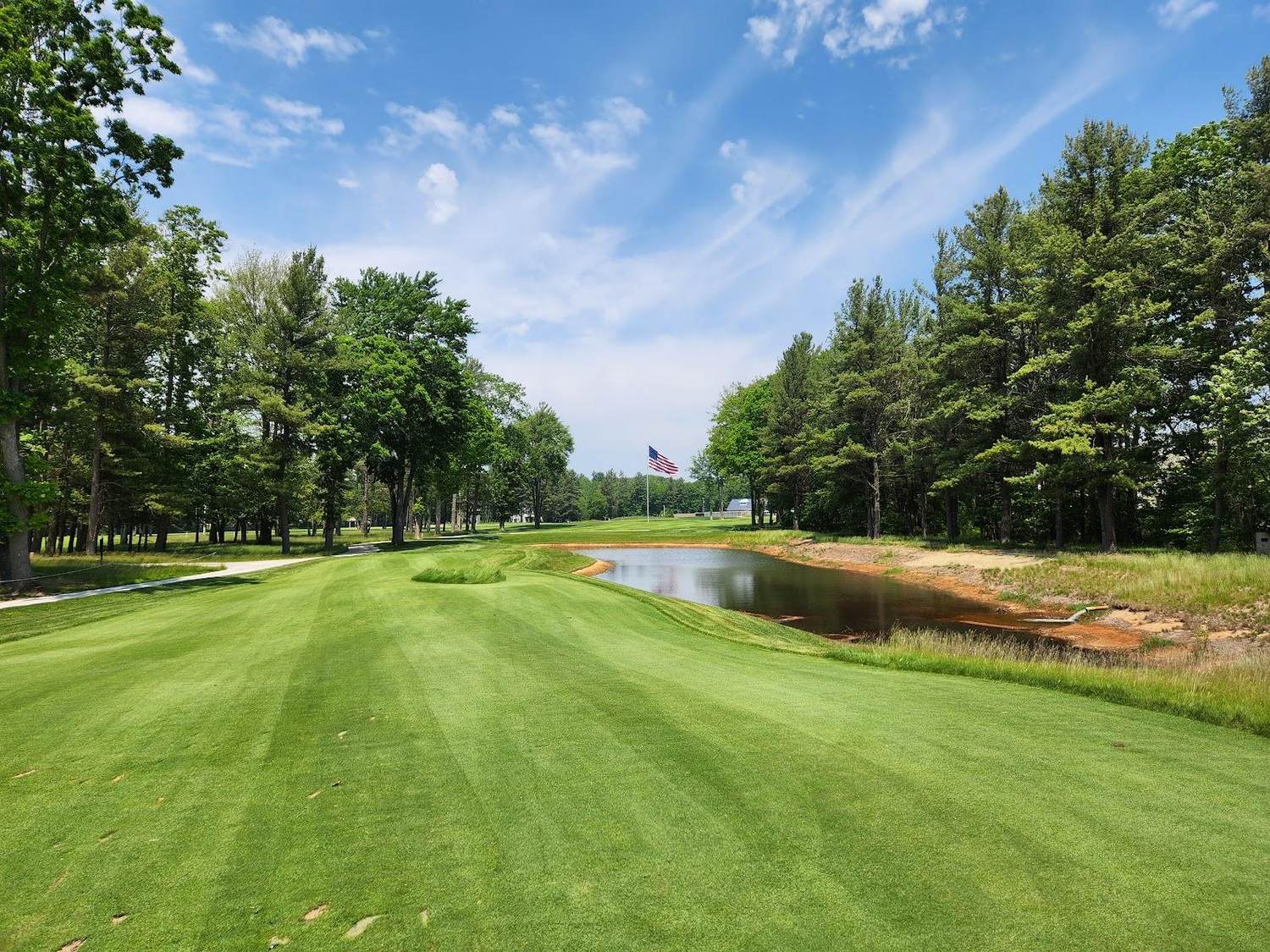 American Dunes Golf Club, a fairway framed by sand and pine near Grand Haven, Michigan