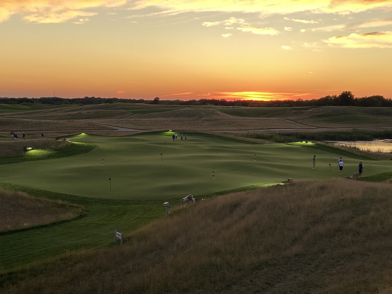 Erin Hills rolling fescue fairways and glacial moraine ridges under a wide Wisconsin sky