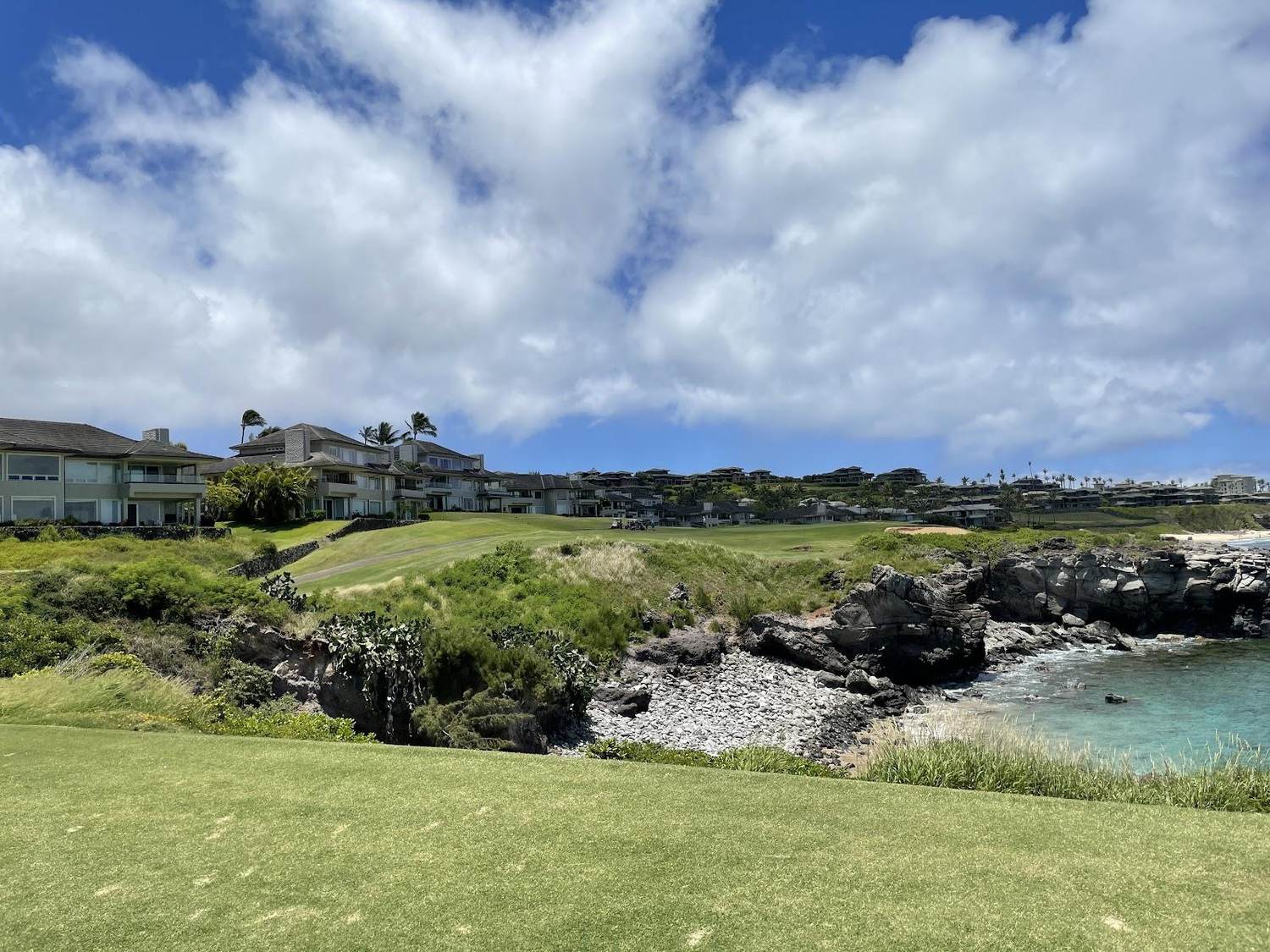 Kapalua Bay Course, coastal fairways and tropical landscaping along the northwest shore of Maui