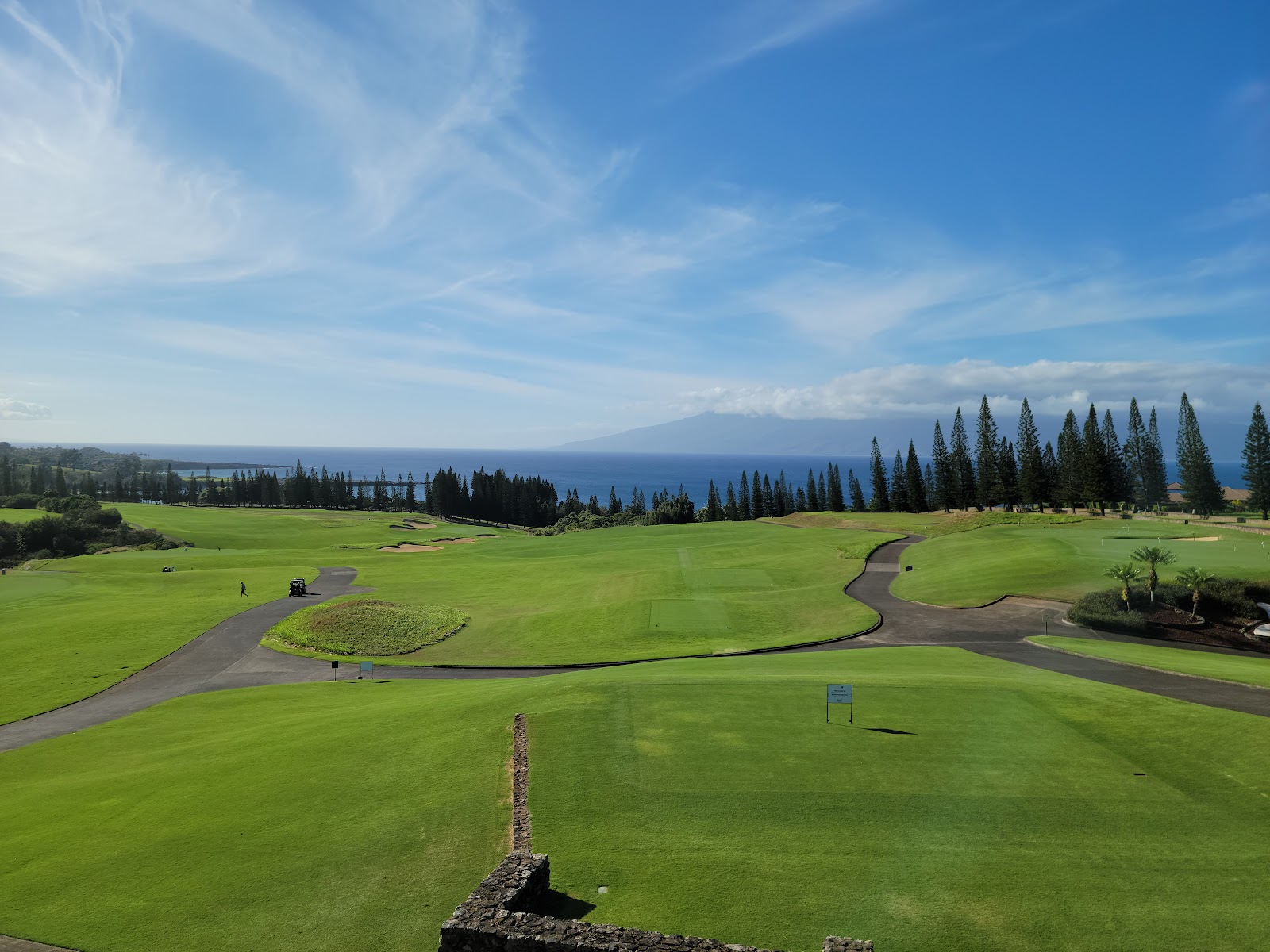 Kapalua Plantation Course, wide fairways tumbling down West Maui slopes toward the Pacific Ocean
