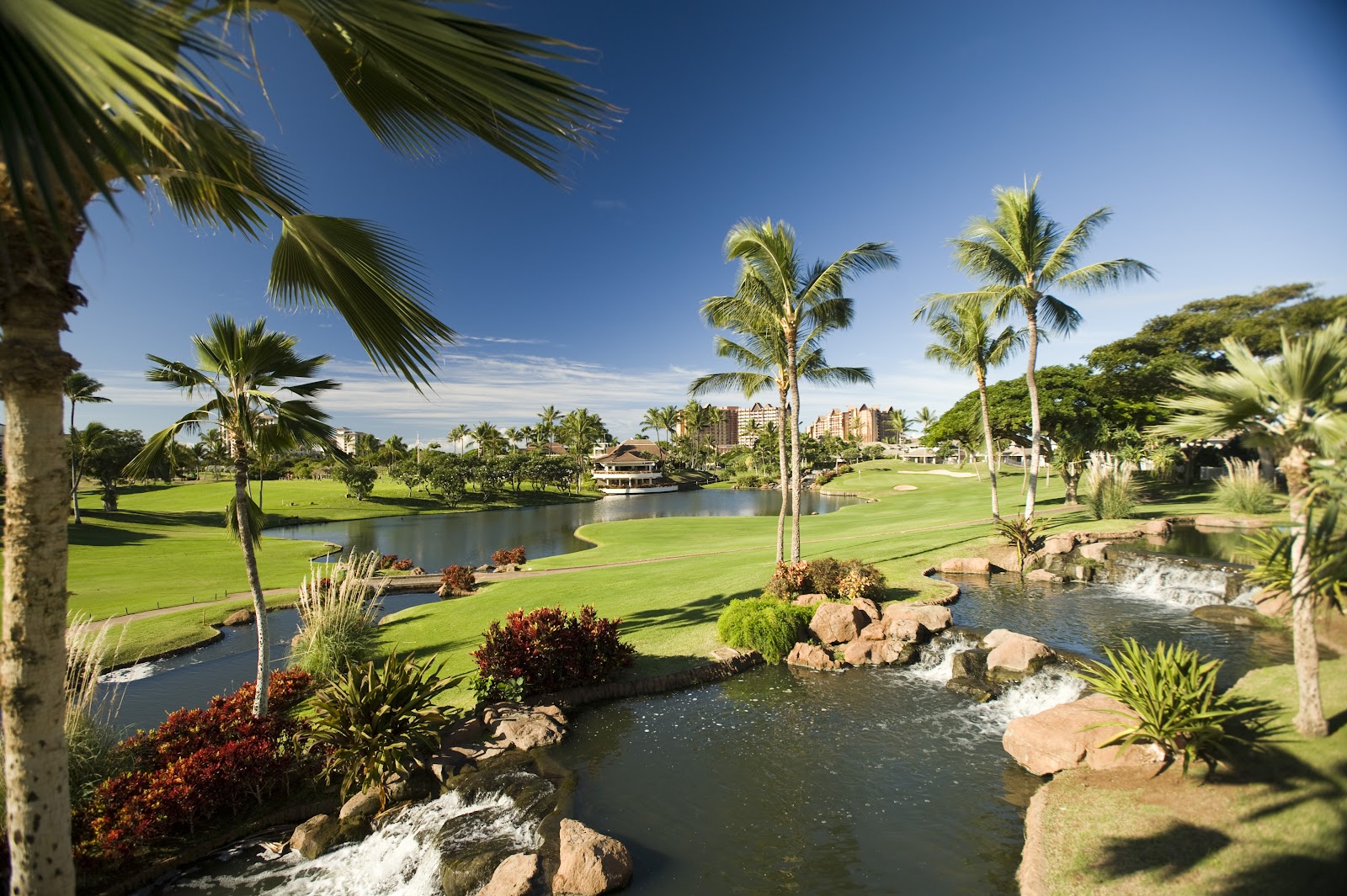 Ko Olina Golf Club, waterfalls and lakes on a Ted Robinson resort course on the leeward coast of Oahu, Hawaii, United States