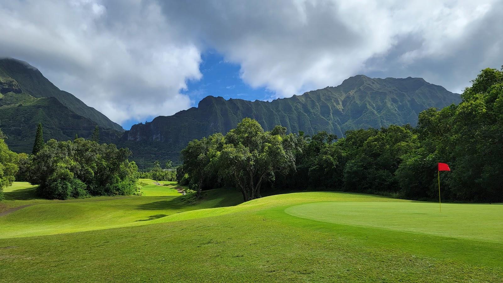 Golf fairways beneath the cliffs of the Koolau mountain range on the windward side of Oahu