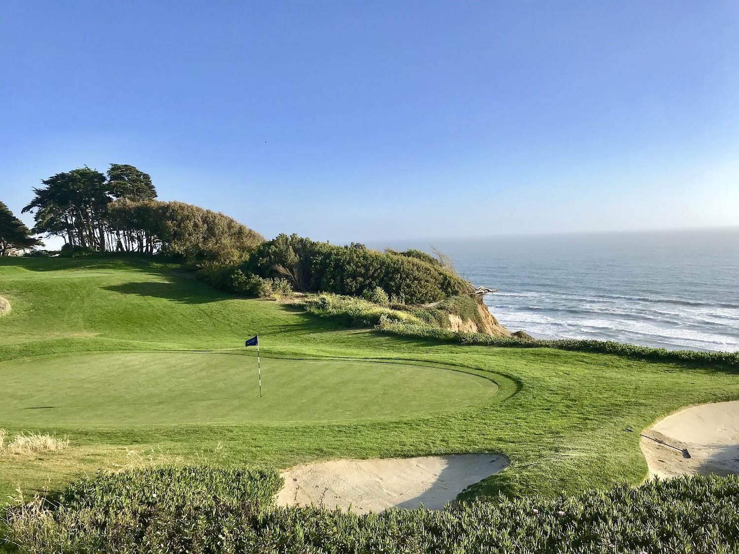 The Olympic Club, tree lined Ocean Course fairway near the Pacific in San Francisco, California