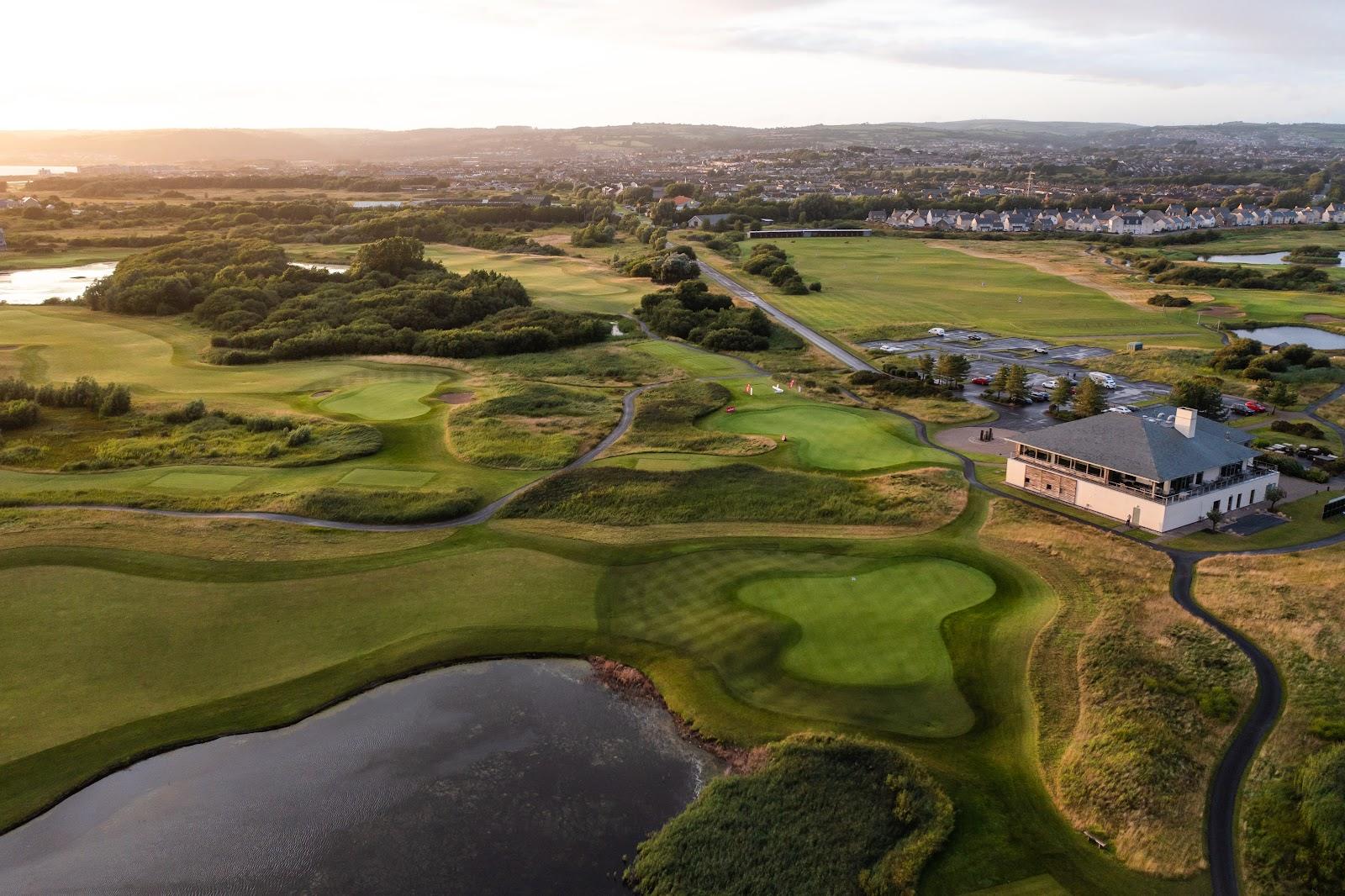 Machynys Peninsula Golf Club, links style fairway and water on the edge of Carmarthen Bay near Llanelli, Wales
