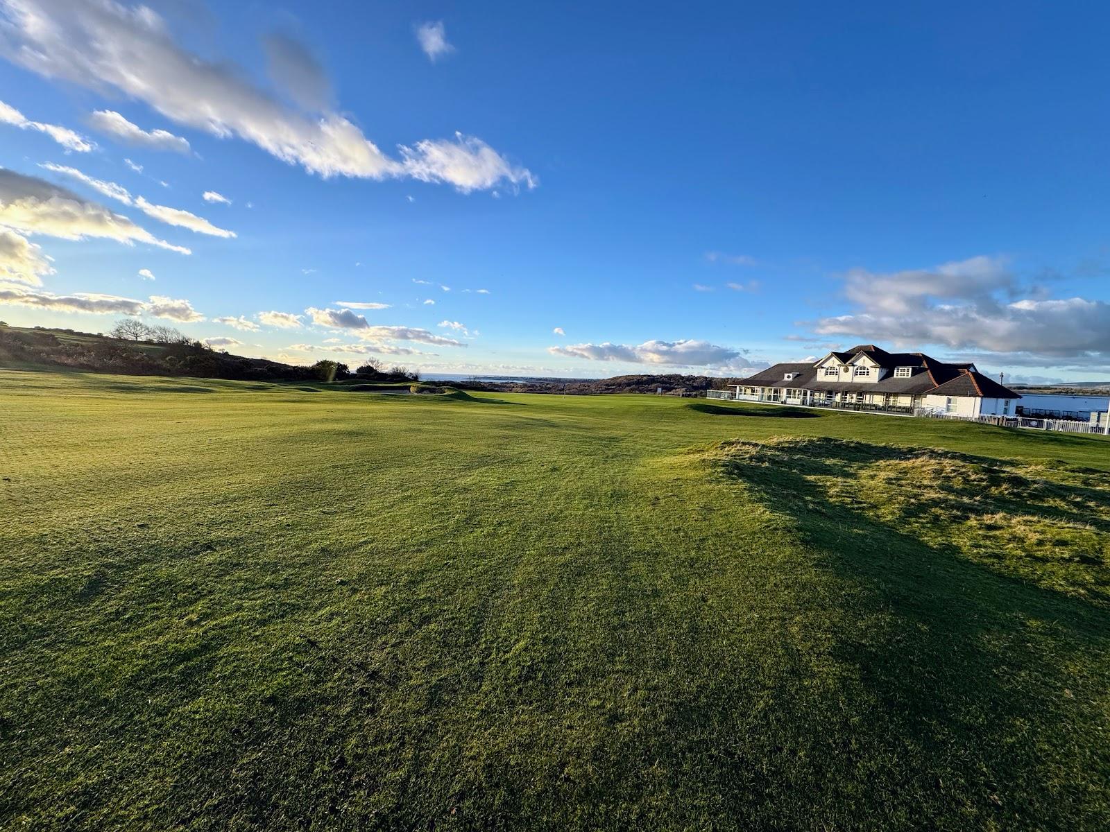 Southerndown Golf Club, downland fairway with gorse and grazing sheep above Ogmore by Sea, Wales